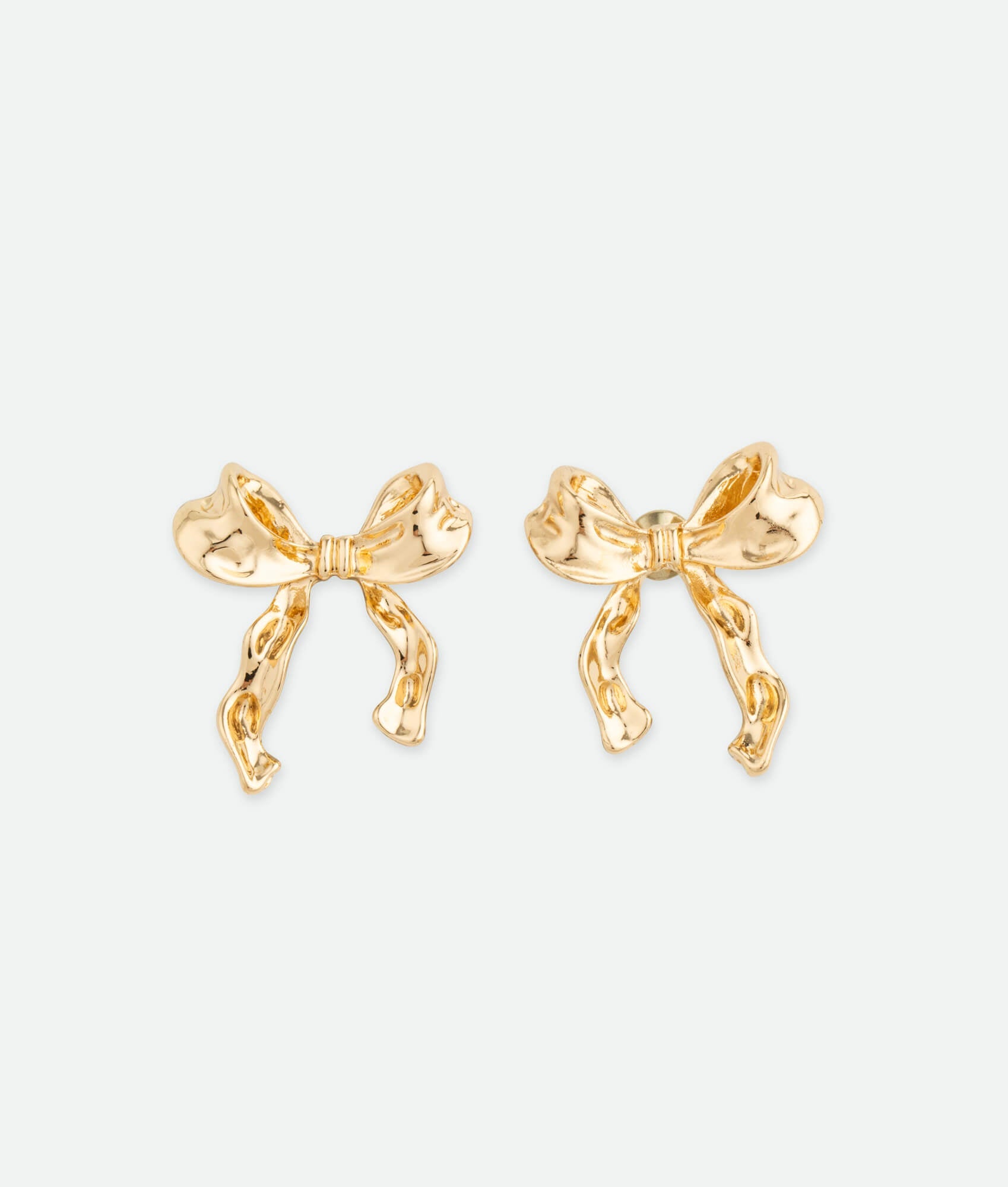 Gold coquette stud earrings