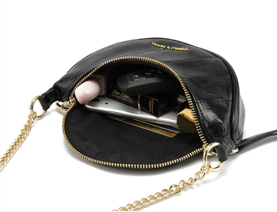 Luna black leather bag open showing interior with phone, cards and keys inside - Valentina