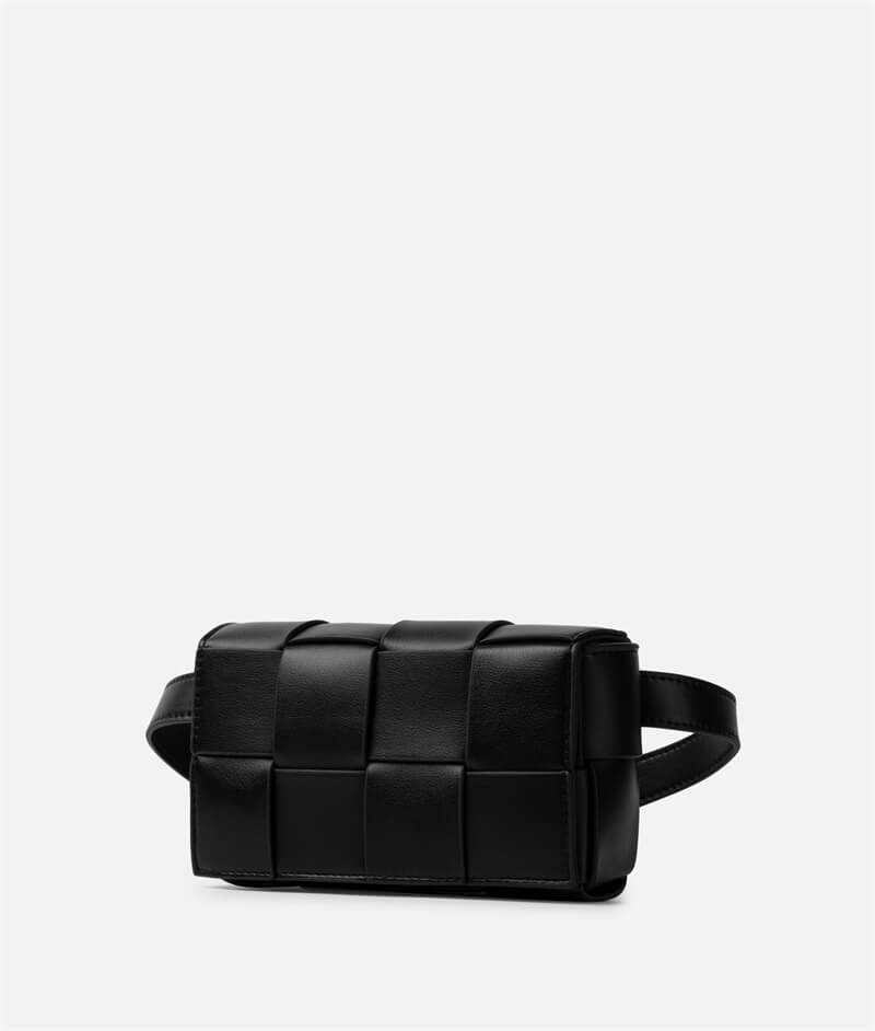 A black mini cassette crossbody belt bag with a sleek design.