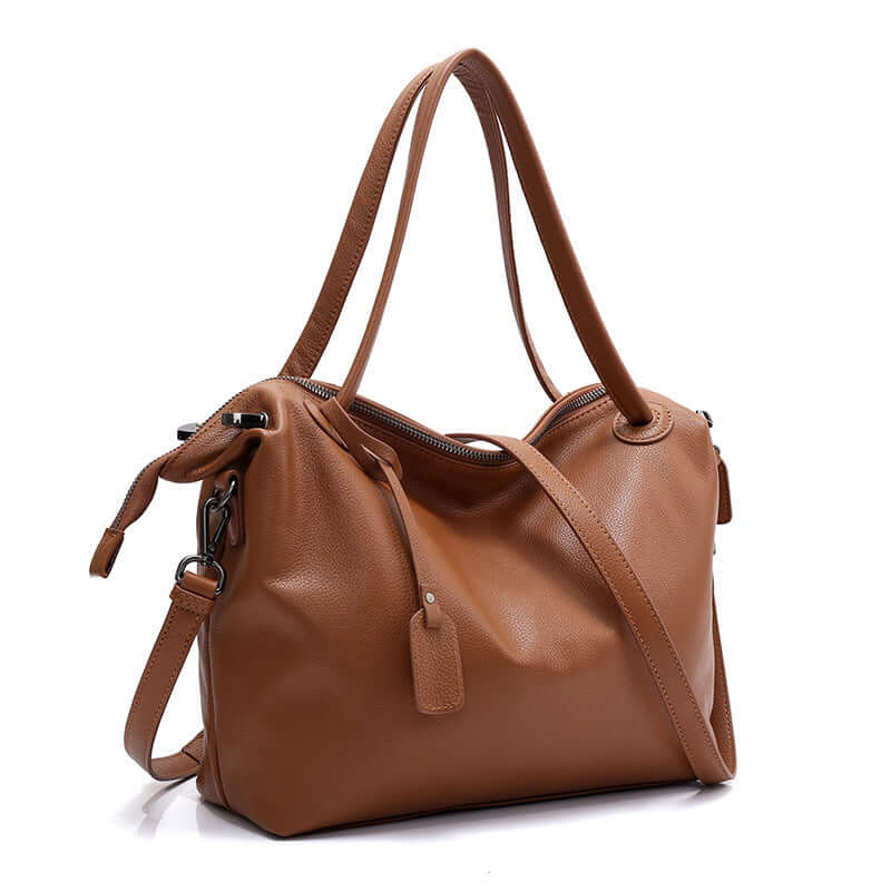A brown leather tote bag with a zipper closure and two handles.