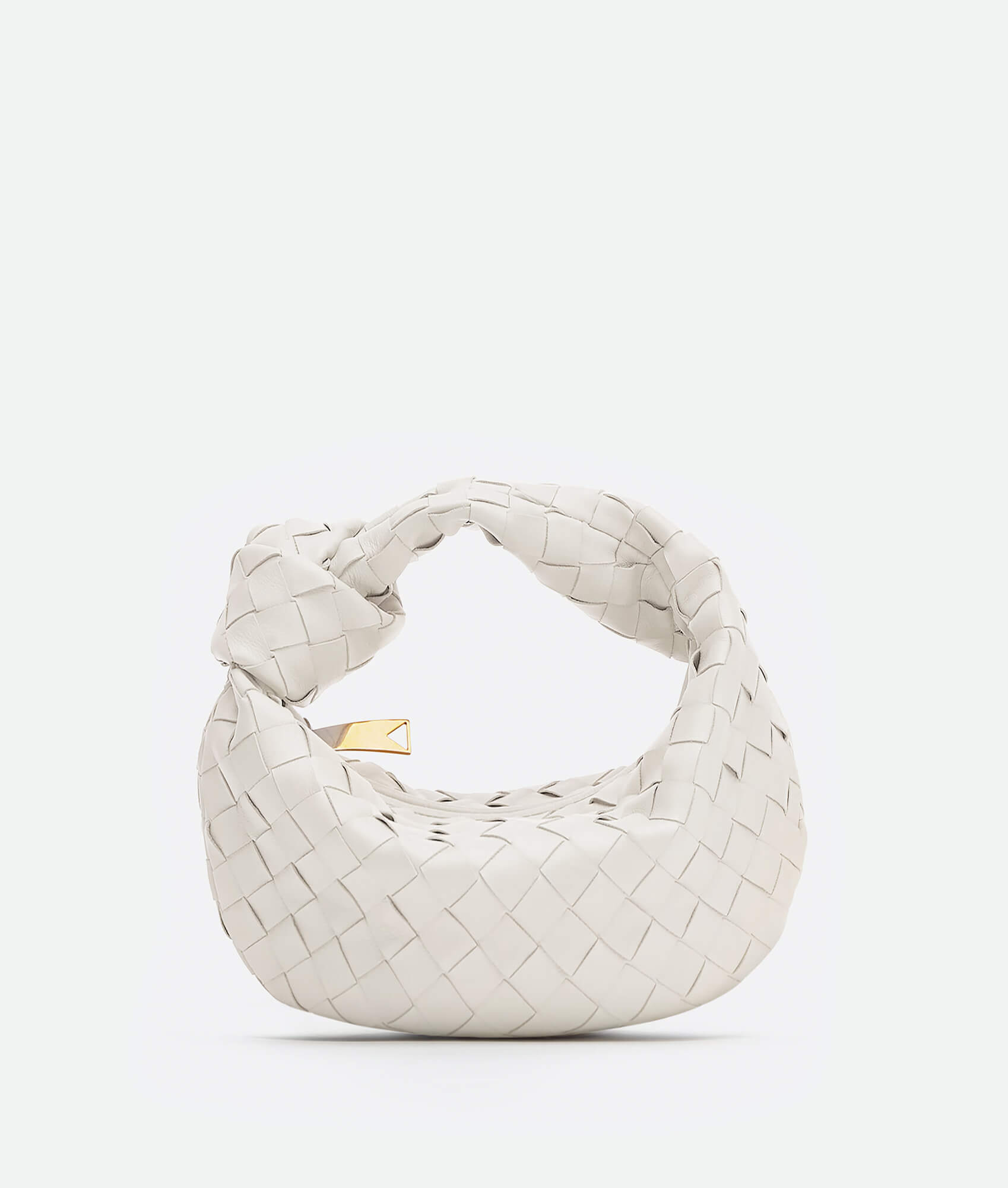 A white woven handbag inspired by the Bottega Mini Jodie design, featuring a compact and rounded shape.