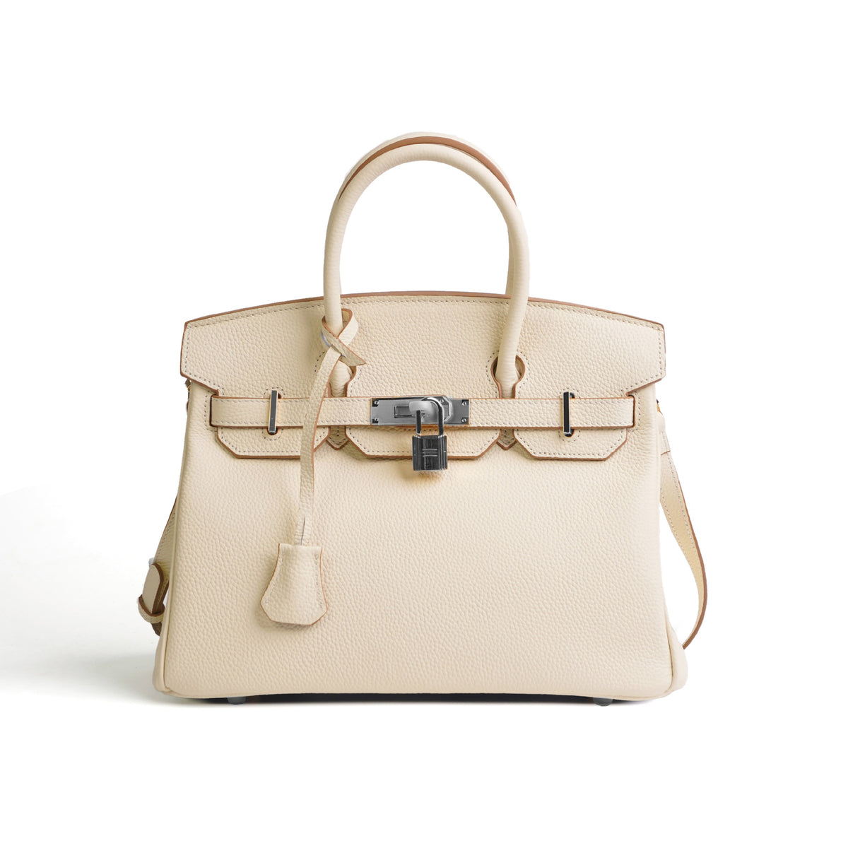 Beige handbag with a lock on a white background