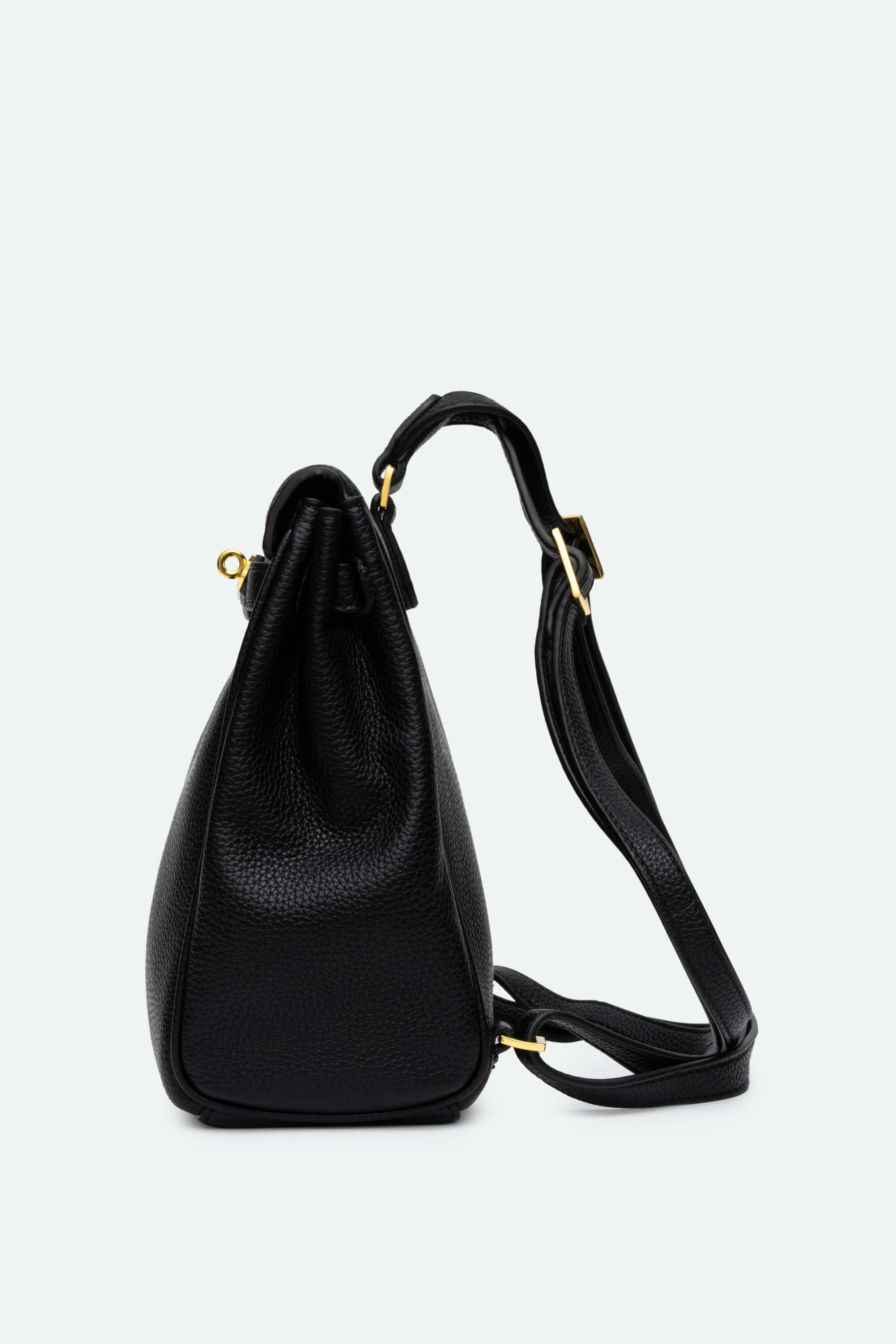 Black leather backpack with a shoulder strap on a light gray background