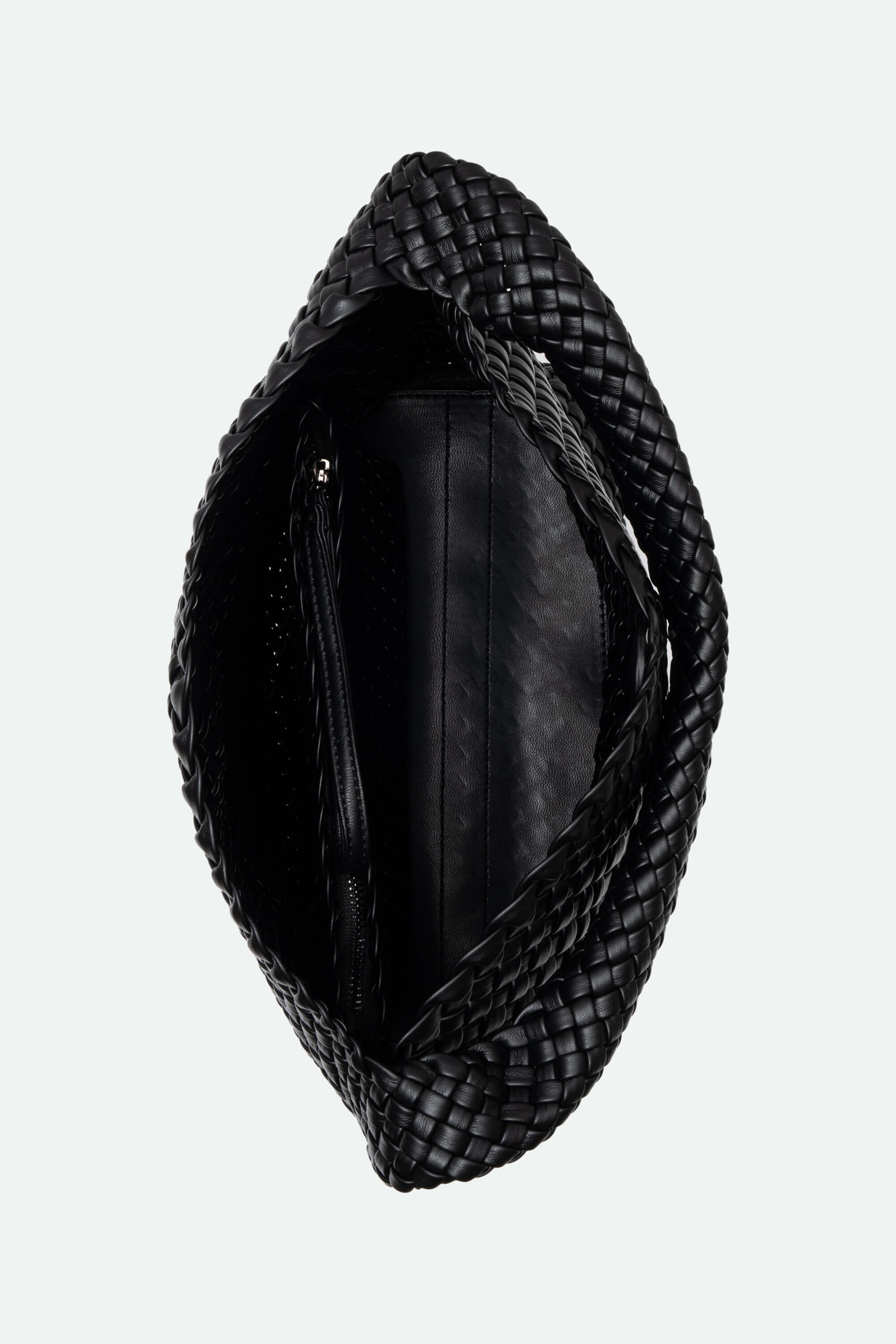 Black woven handbag on a light gray background