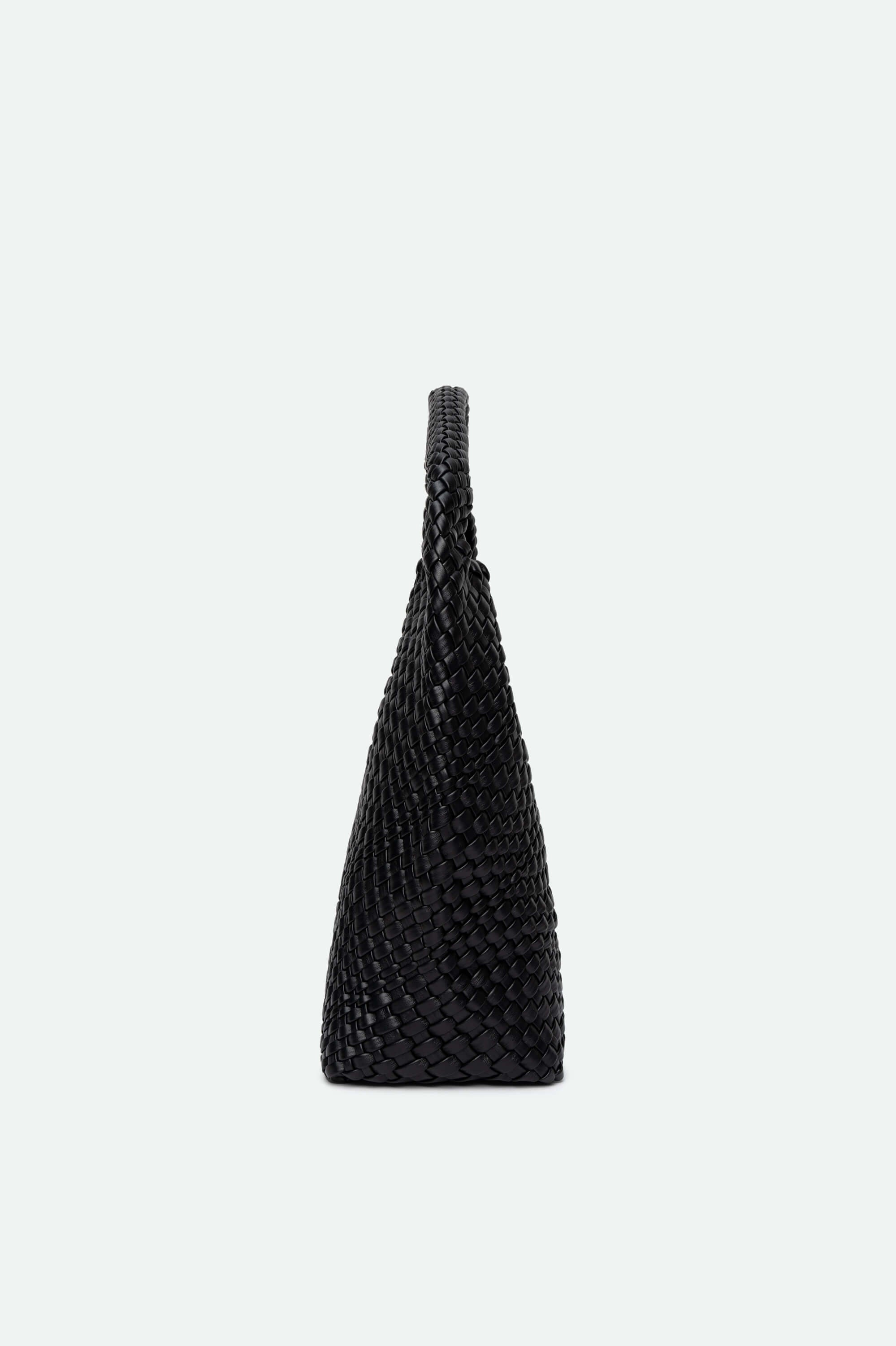 Black woven handbag on a white background