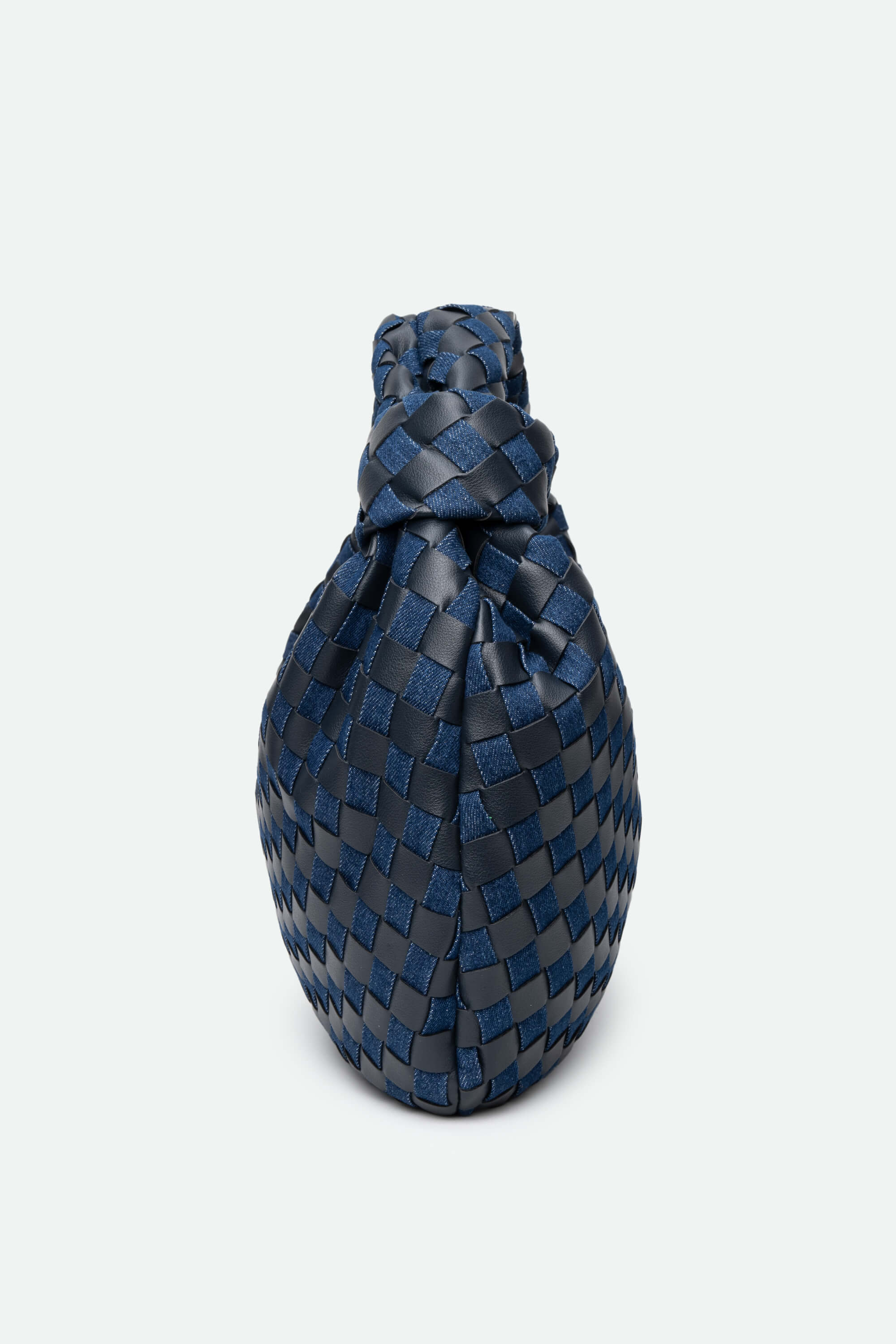 Blue woven clutch bag on a light gray background