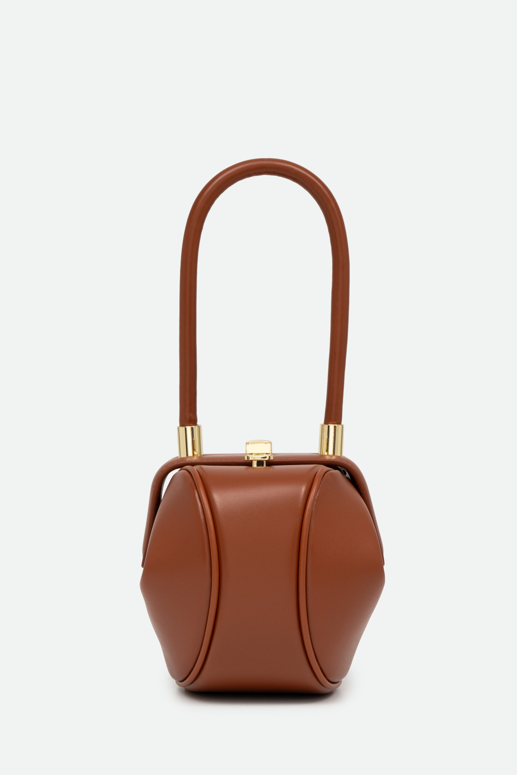 Brown handbag with gold accents on a white background