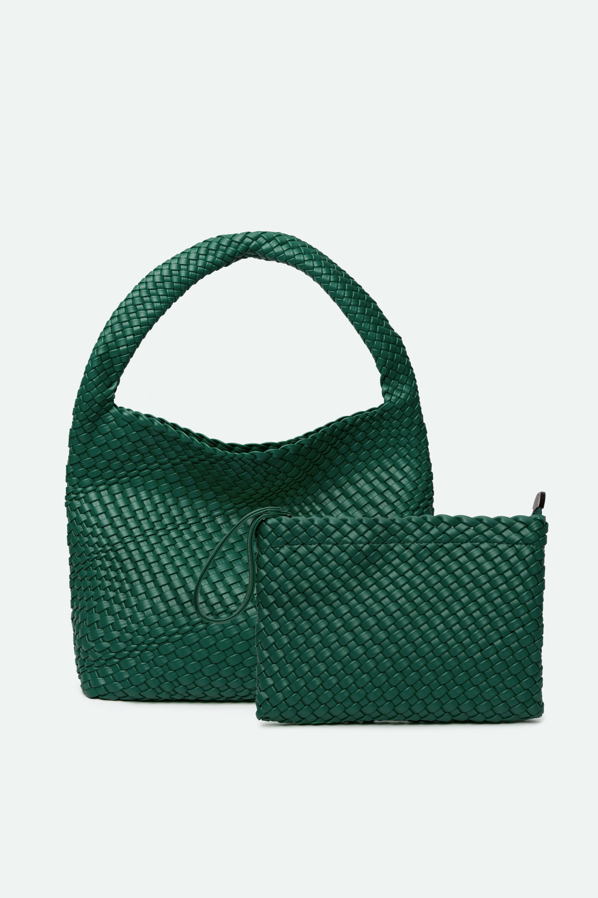 Green woven handbag with matching pouch on a light gray background