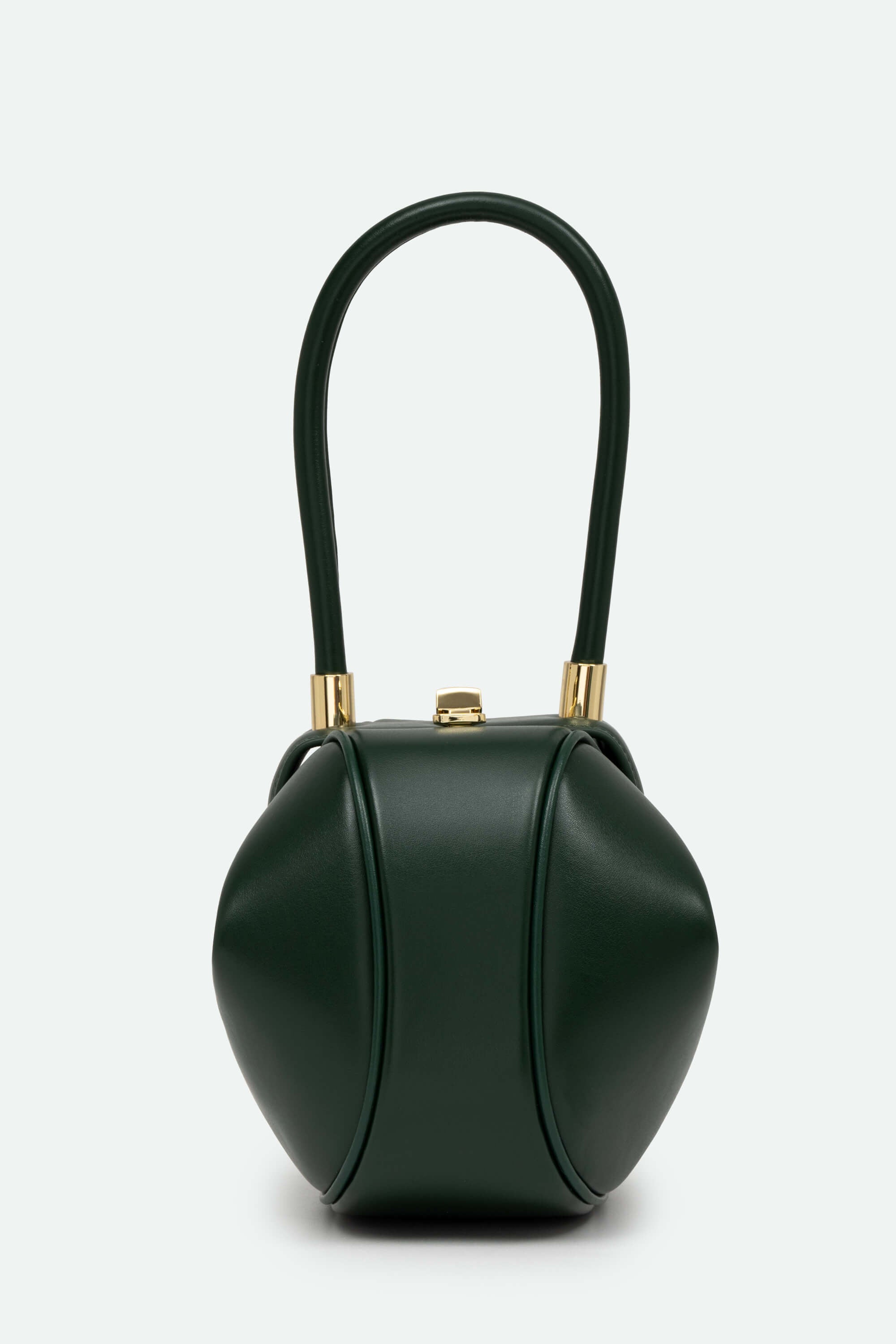 Green handbag with gold accents on a white background