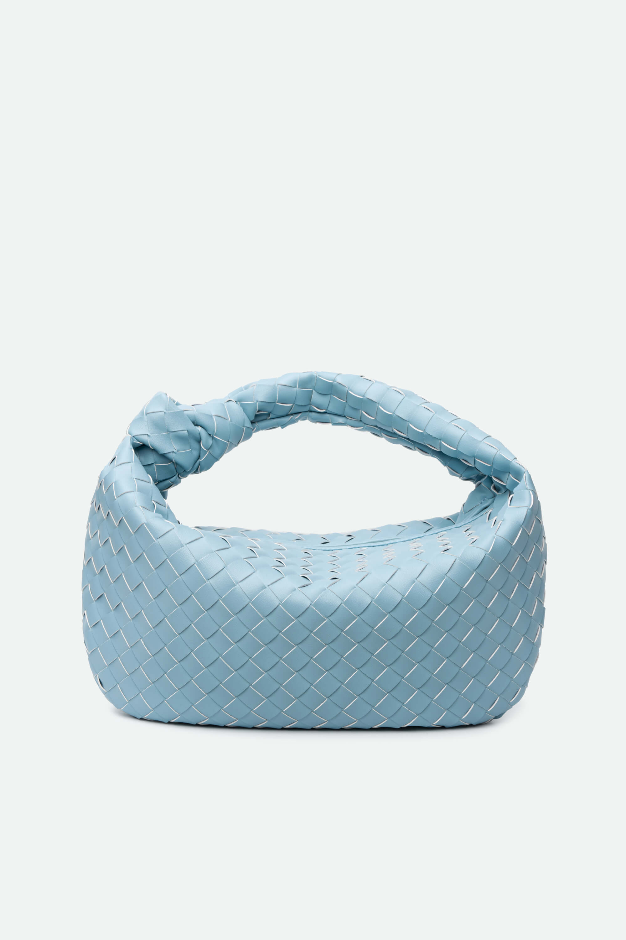Light blue woven handbag on a white background