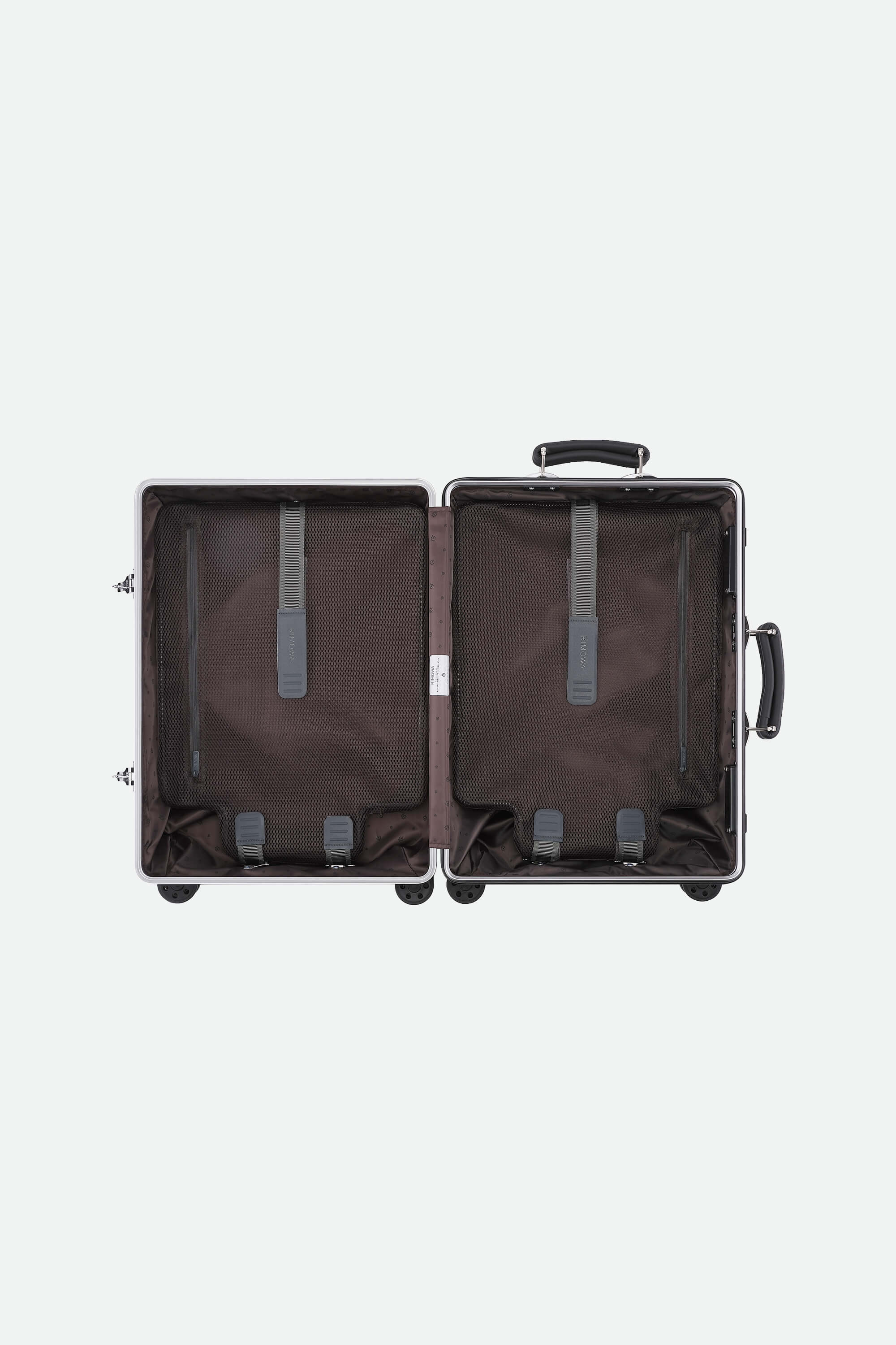 Open suitcase on a light gray background
