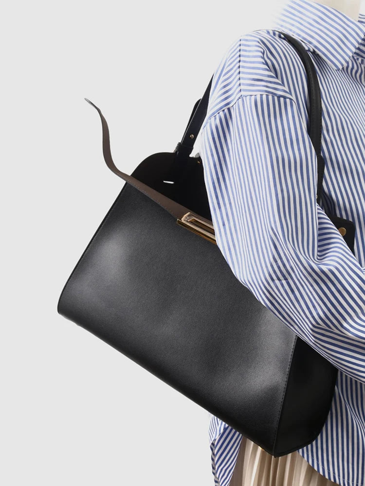 Valentina Siracusa top-handle bag in Apricot, worn