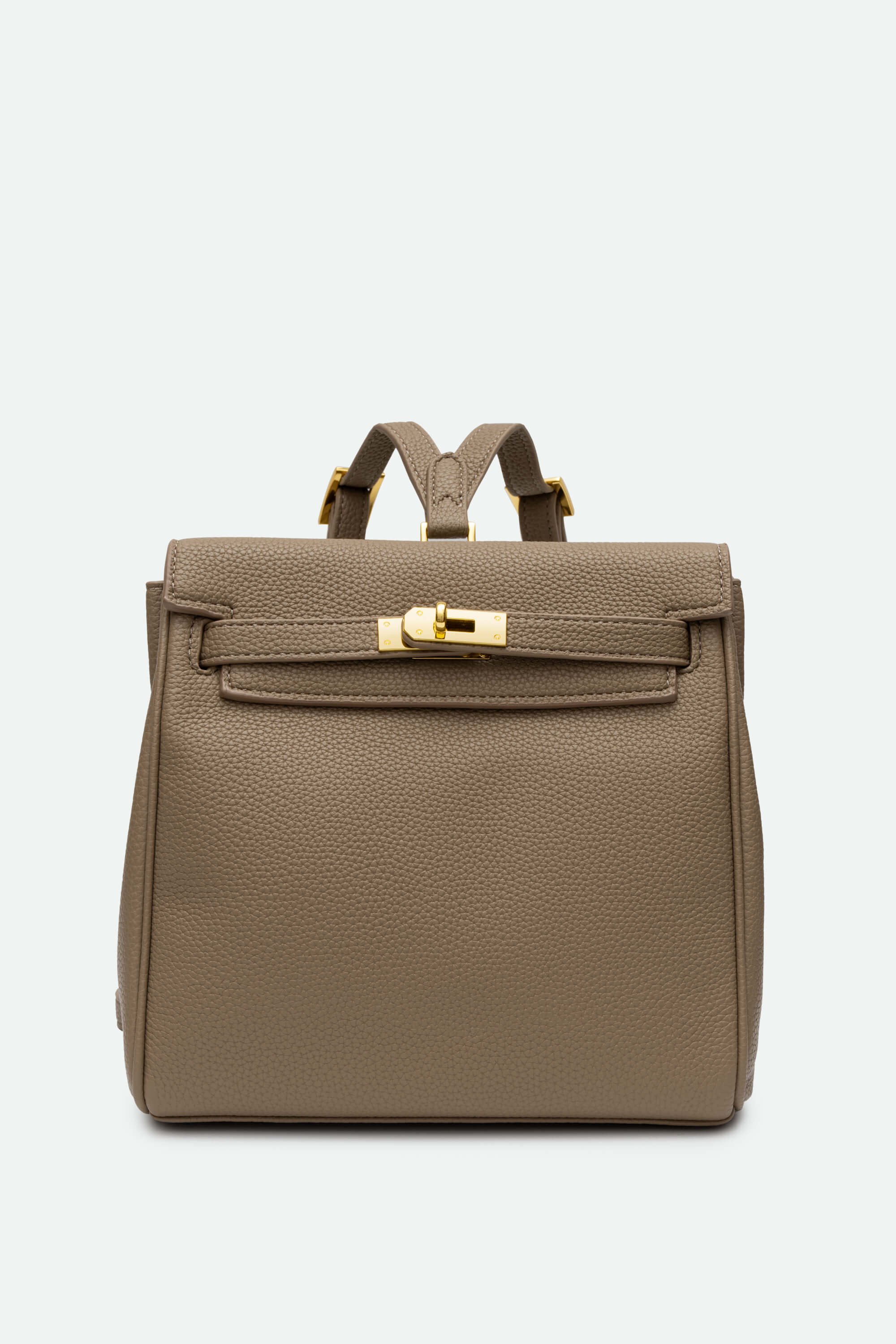 Brown backpack with gold hardware on a light gray background