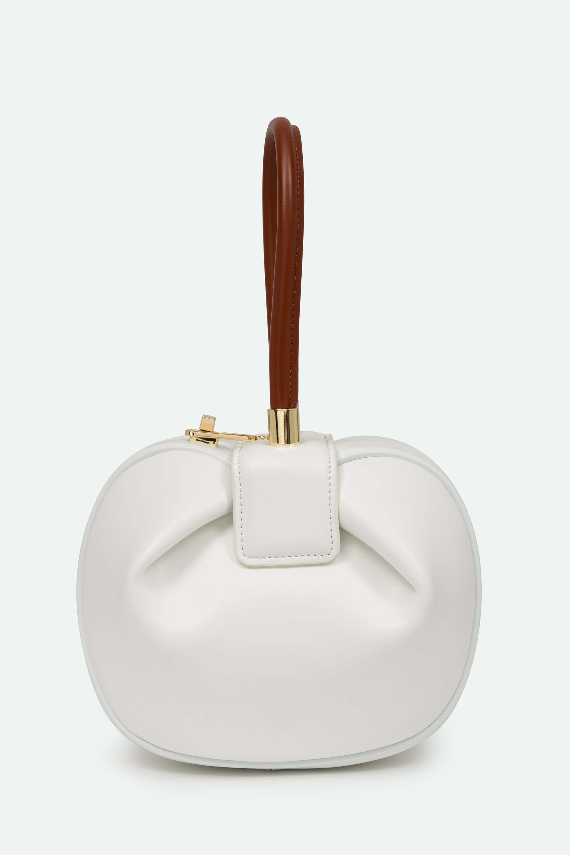 White handbag with a brown handle on a white background