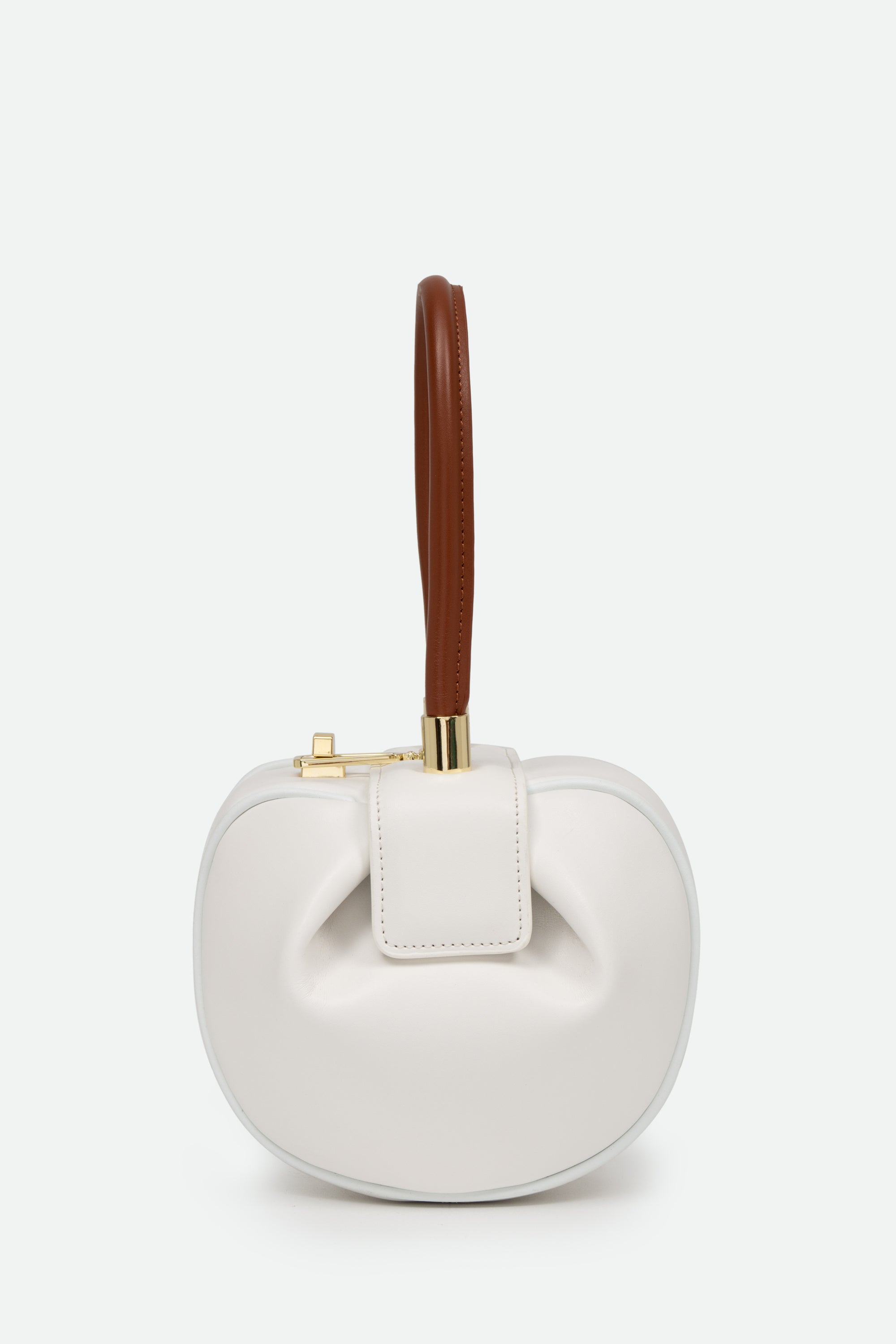 White handbag with a brown handle on a white background