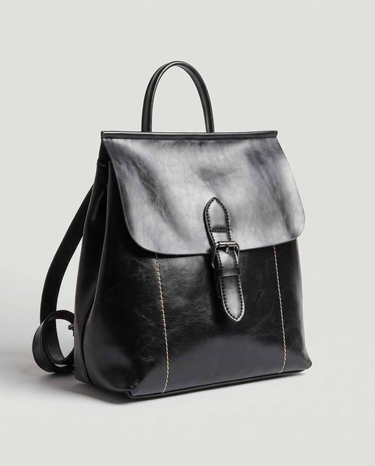 Ambler waxed leather backpack in Black – three-quarter view