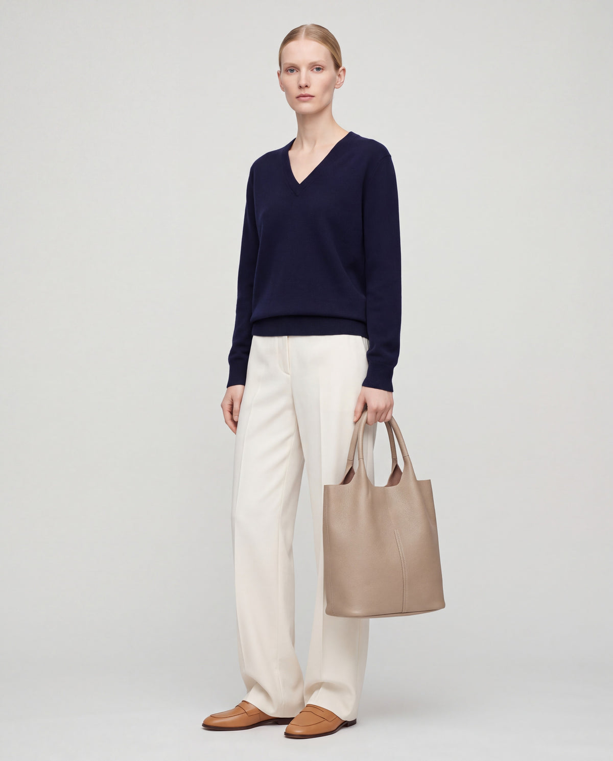 Arco bag in Beige – worn by model, full length