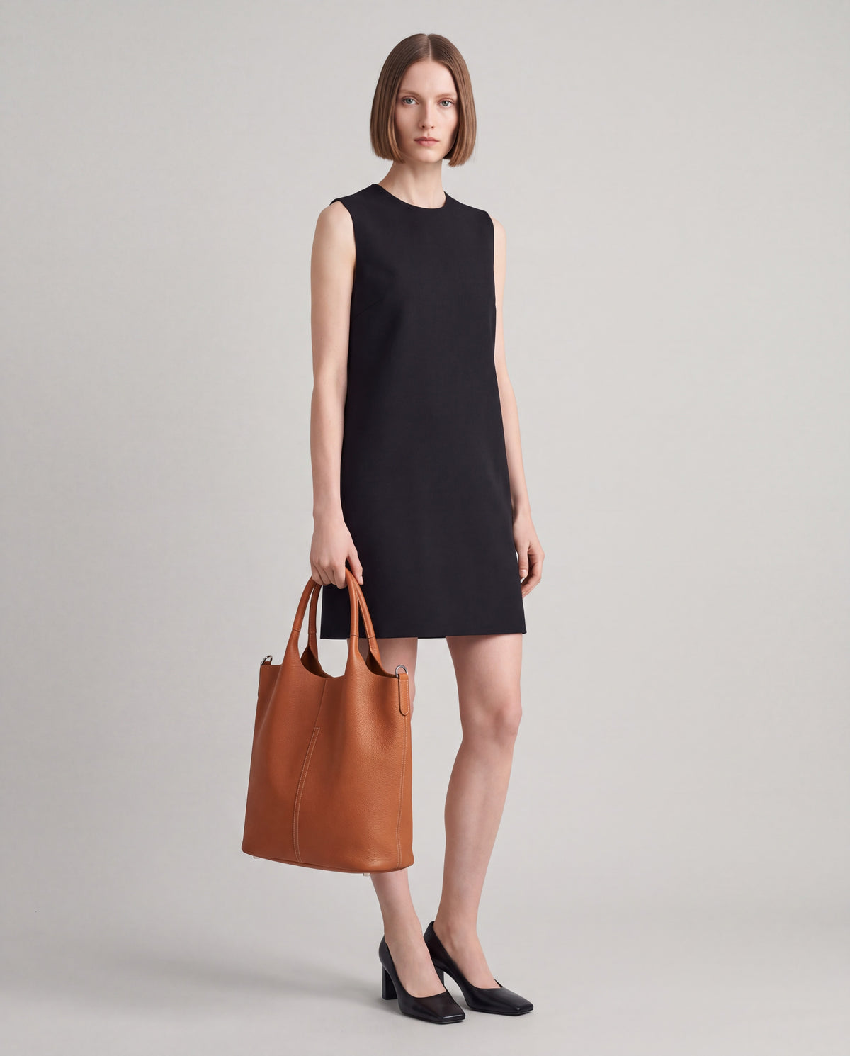 Arco bag in Cognac – worn by model, full length