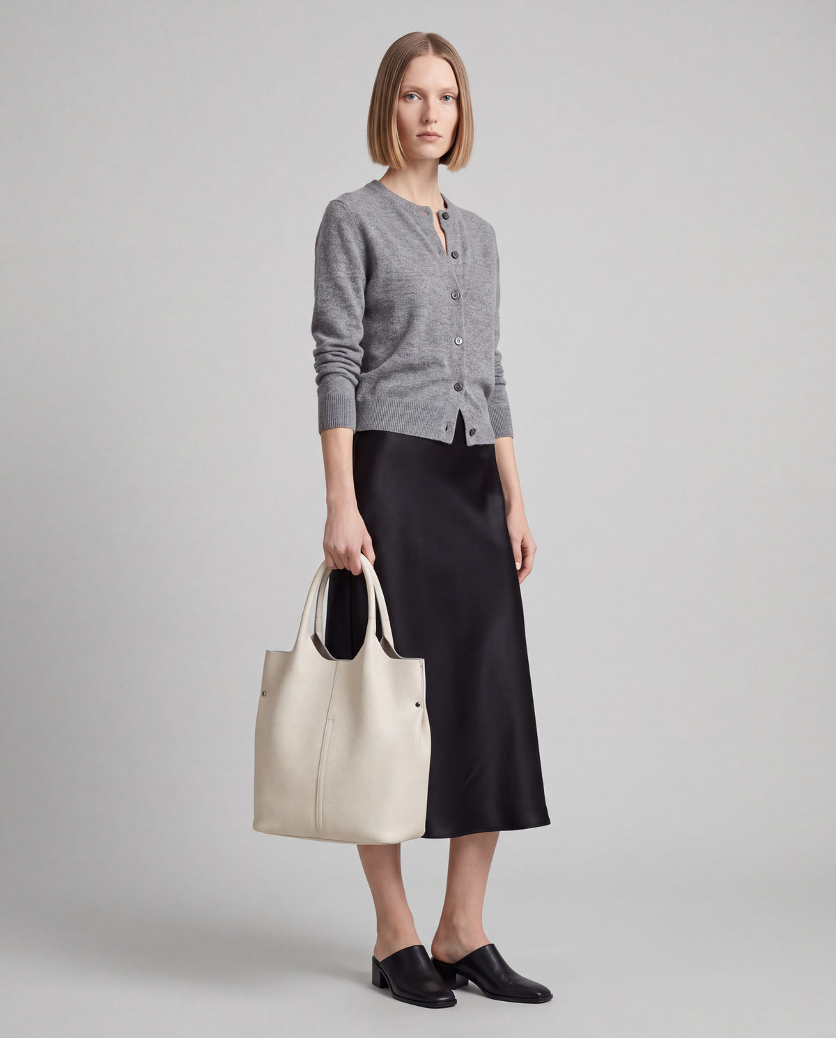 Arco bag in Cream – worn by model, full length