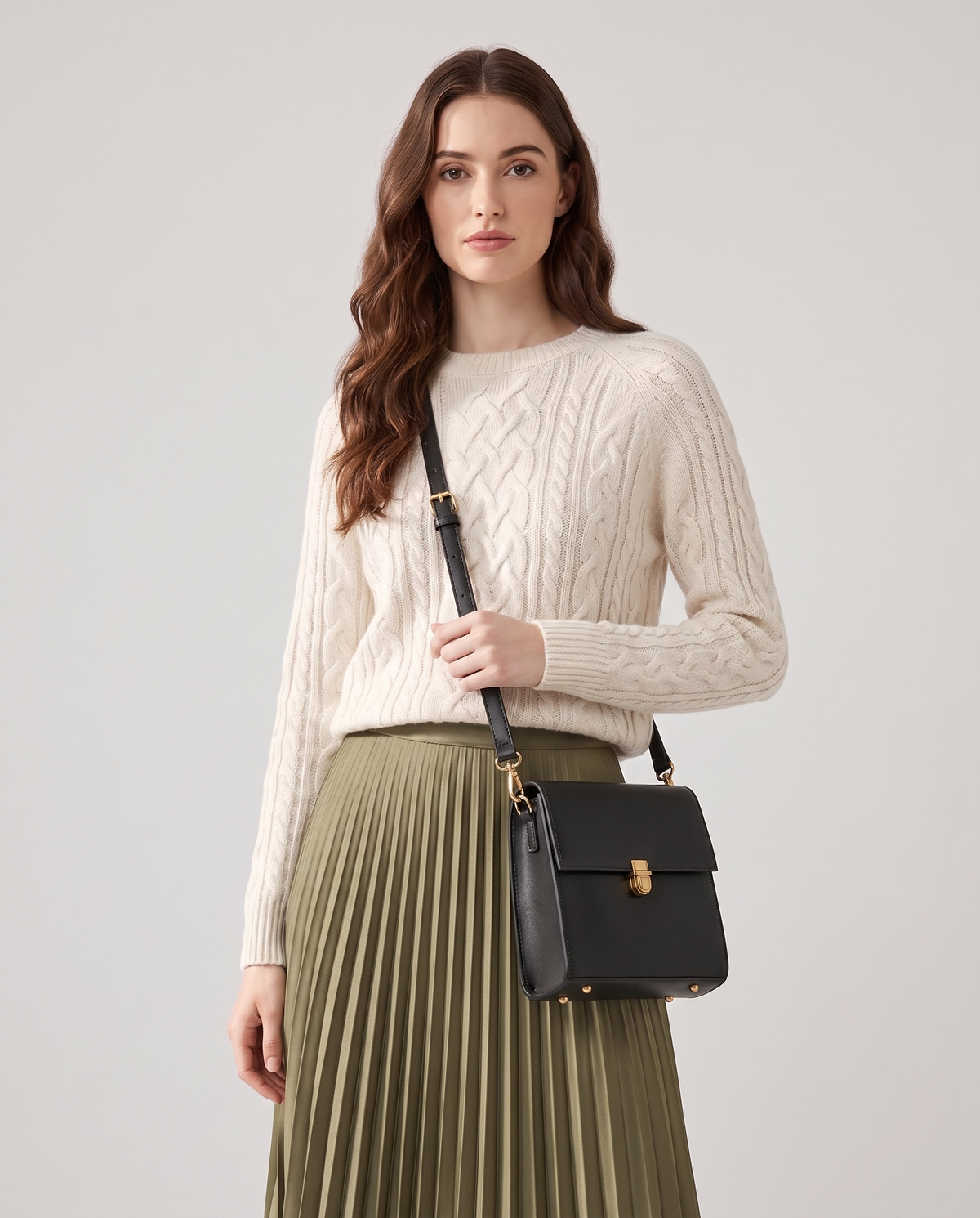 Bloc square vegan leather crossbody bag in Black – model wearing it crossbody, waist-up