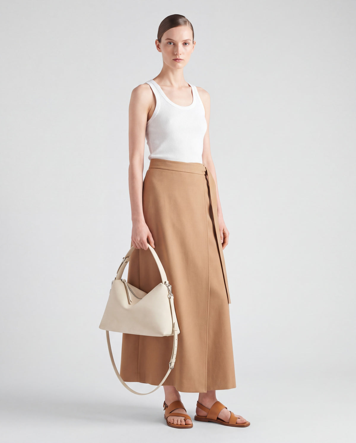 Calma bag in Ivory – worn by model, full length