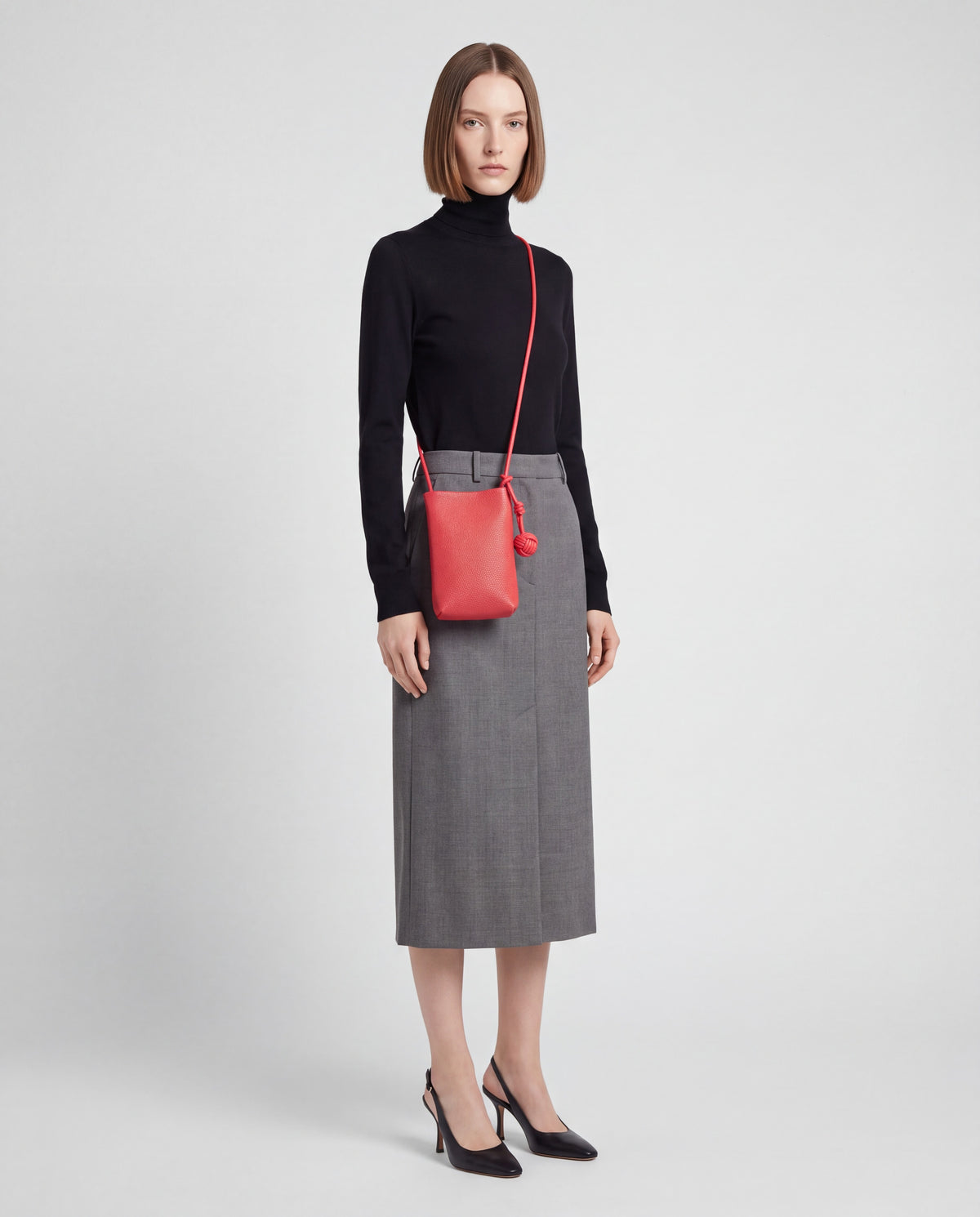 Cara bag in Red – worn by model, full length