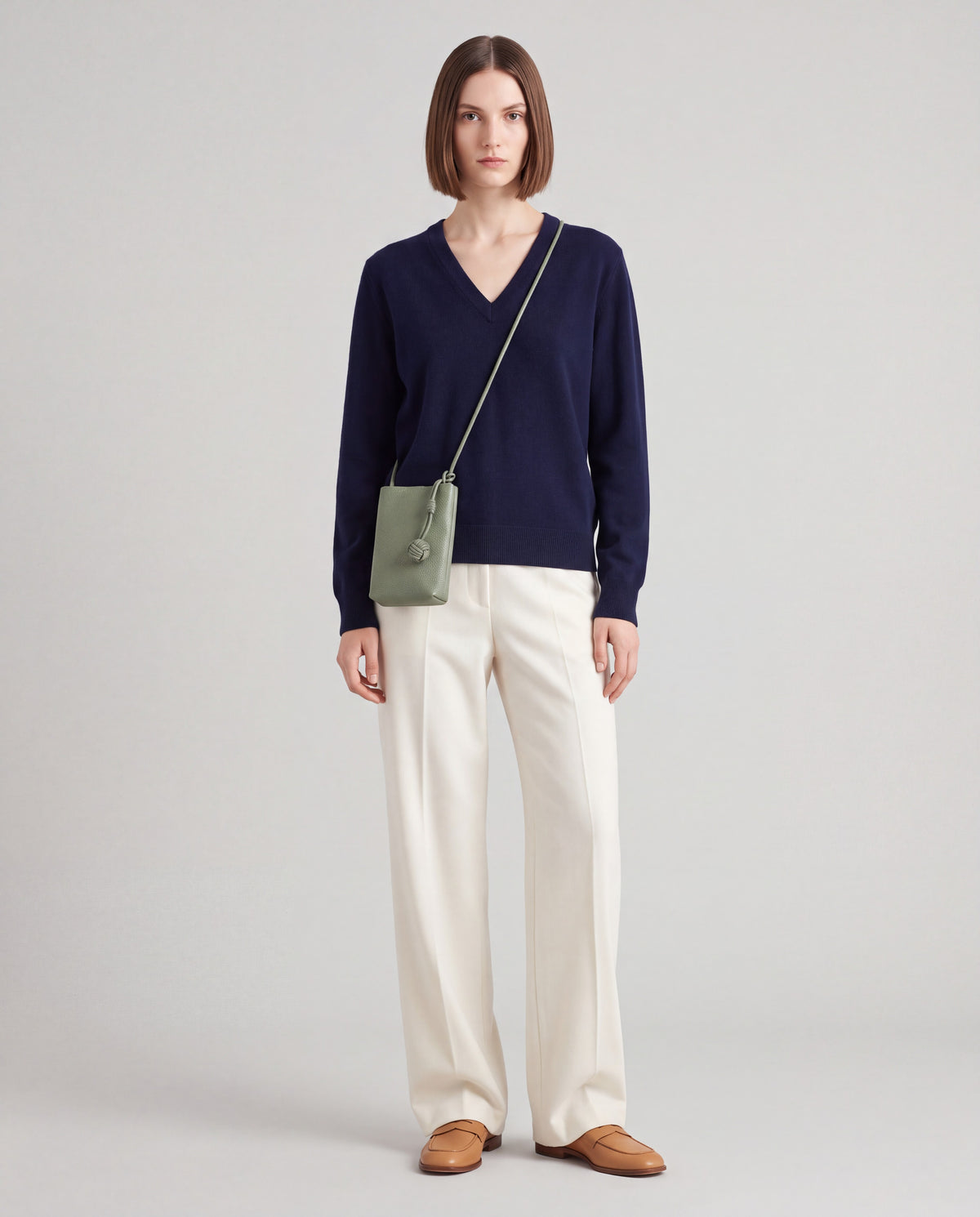 Cara bag in Sage – worn by model, full length