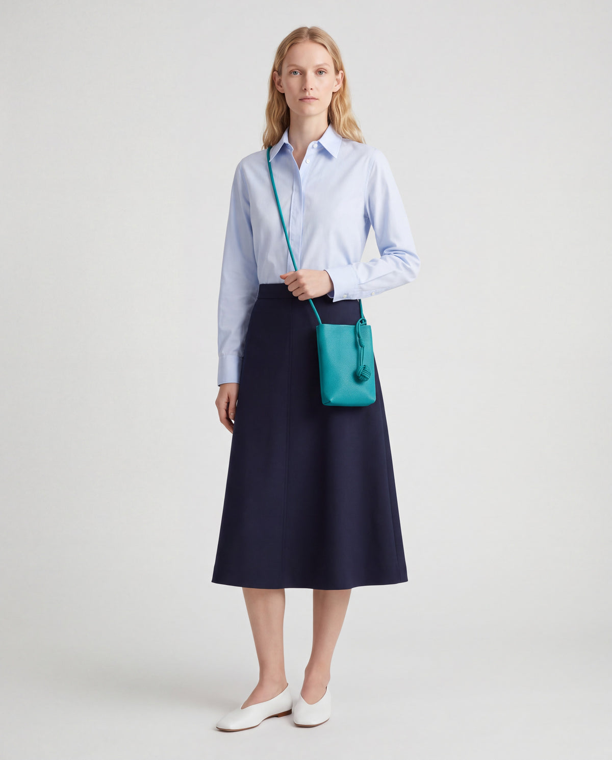 Cara bag in Teal – worn by model, full length