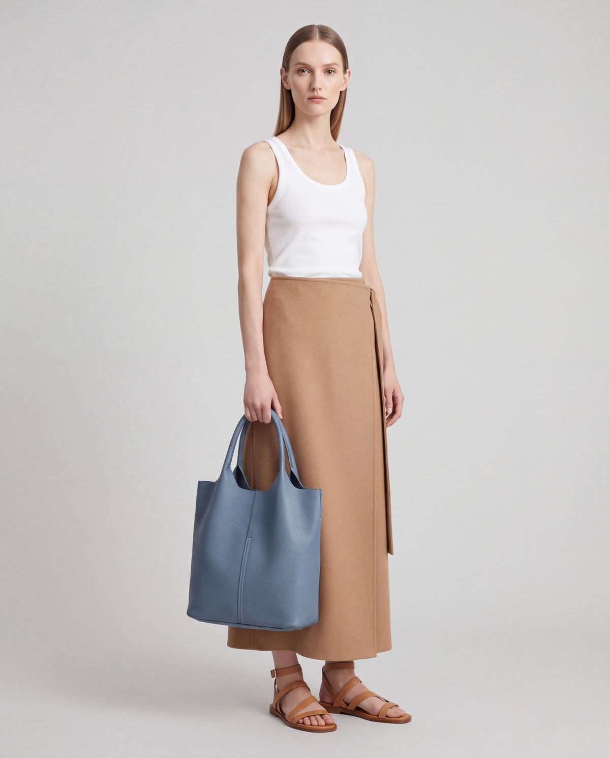Commute bag in Blue – worn by model, full length