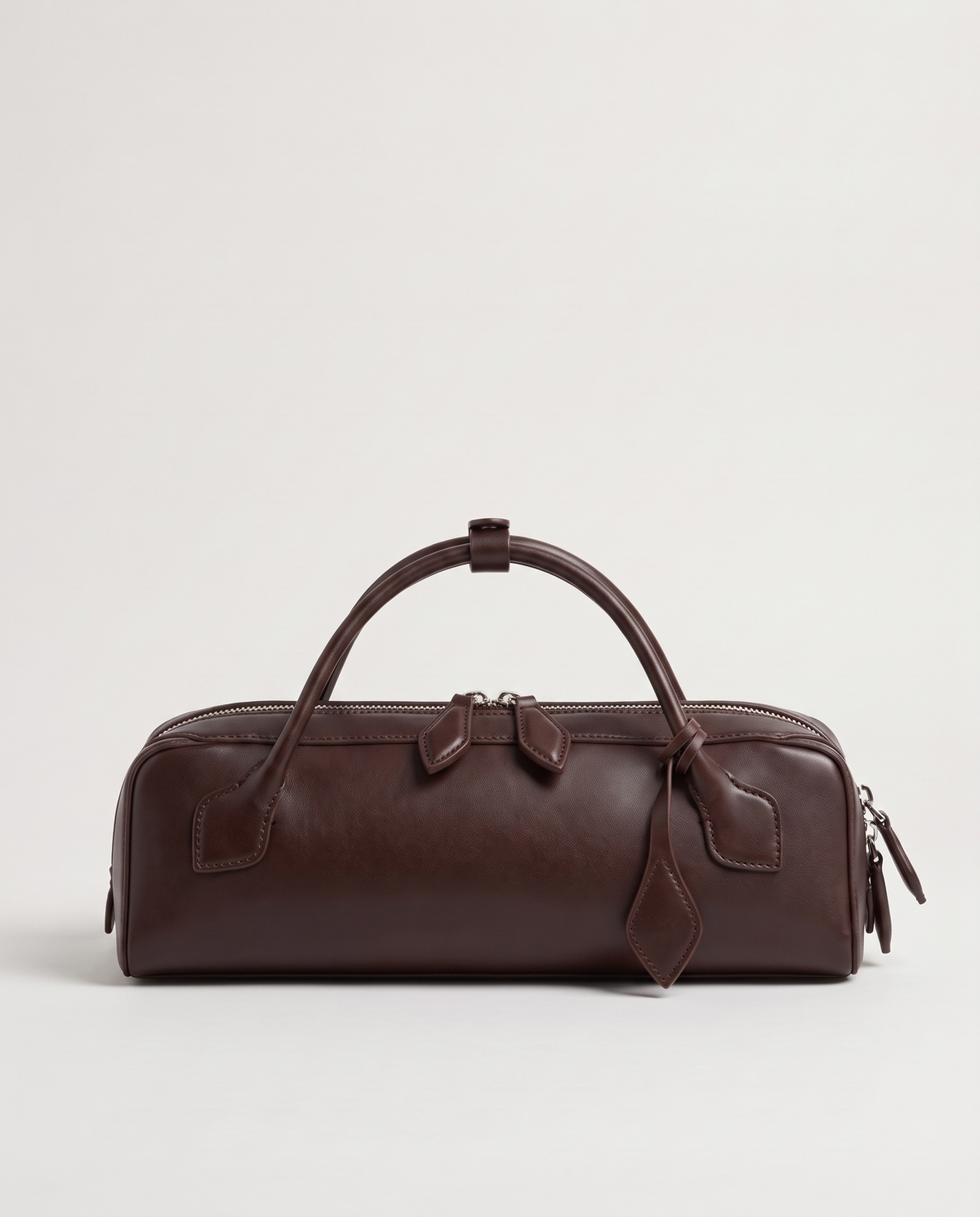 Curve leather barrel bag in Brown – back view