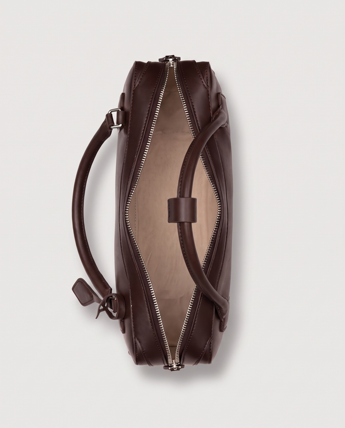 Curve leather barrel bag in Brown – inside view with the zip open
