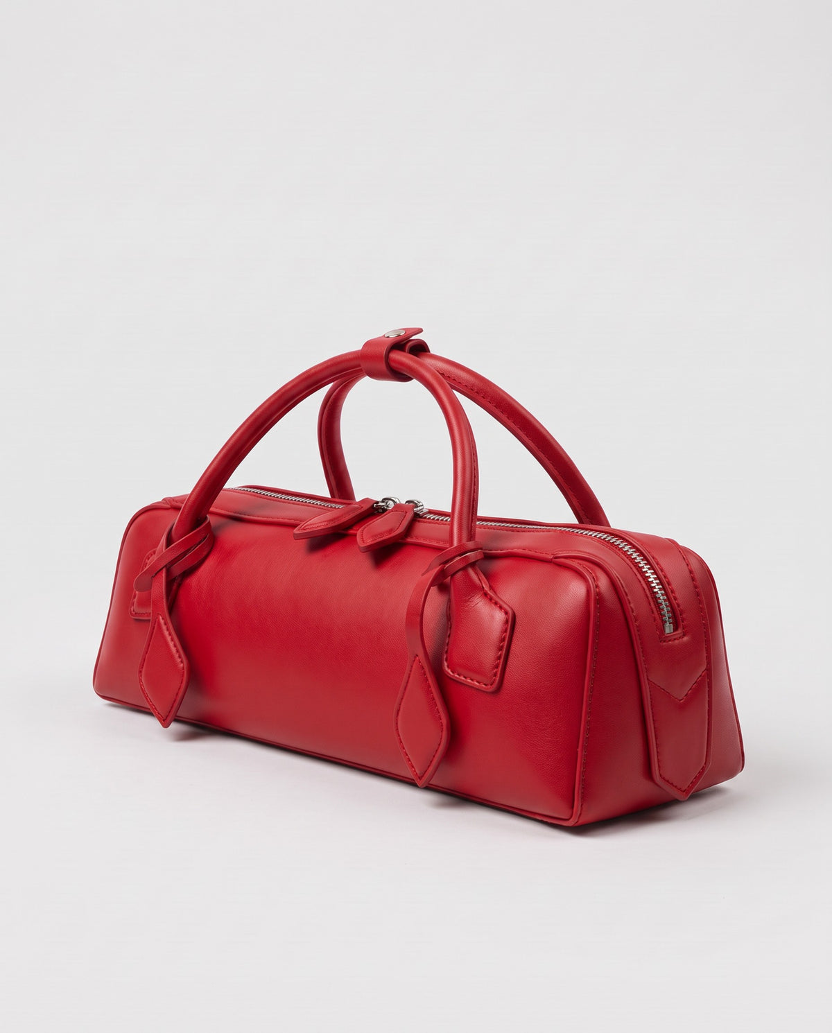 Curve leather barrel bag in Red – three-quarter view