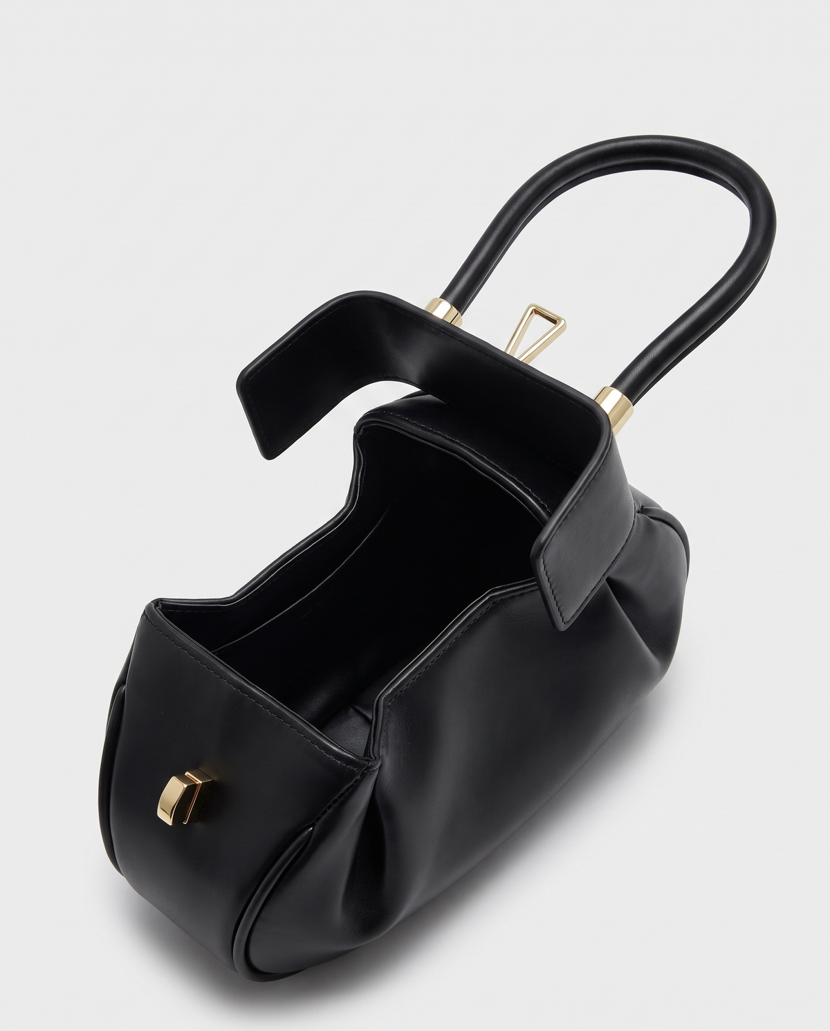 Dumpling Maxi leather top-handle bag in Black – open, showing the leather-lined interior