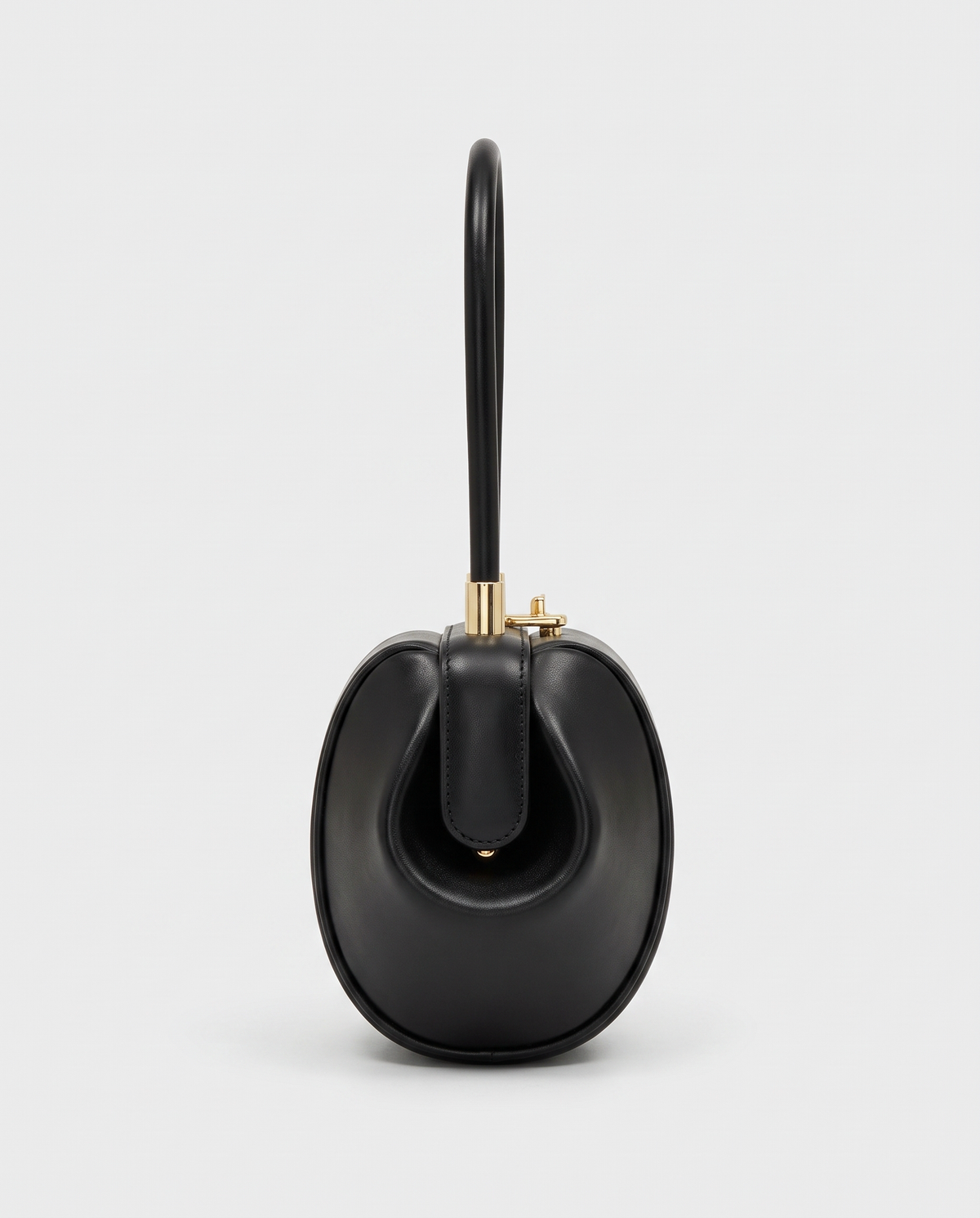 Dumpling Mini leather top-handle bag in Black – side view