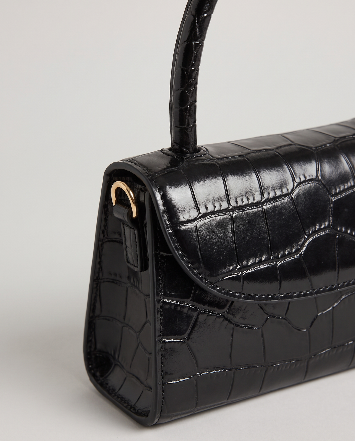 Fern mini croc top-handle bag in Black – close-up of the croc texture and flap