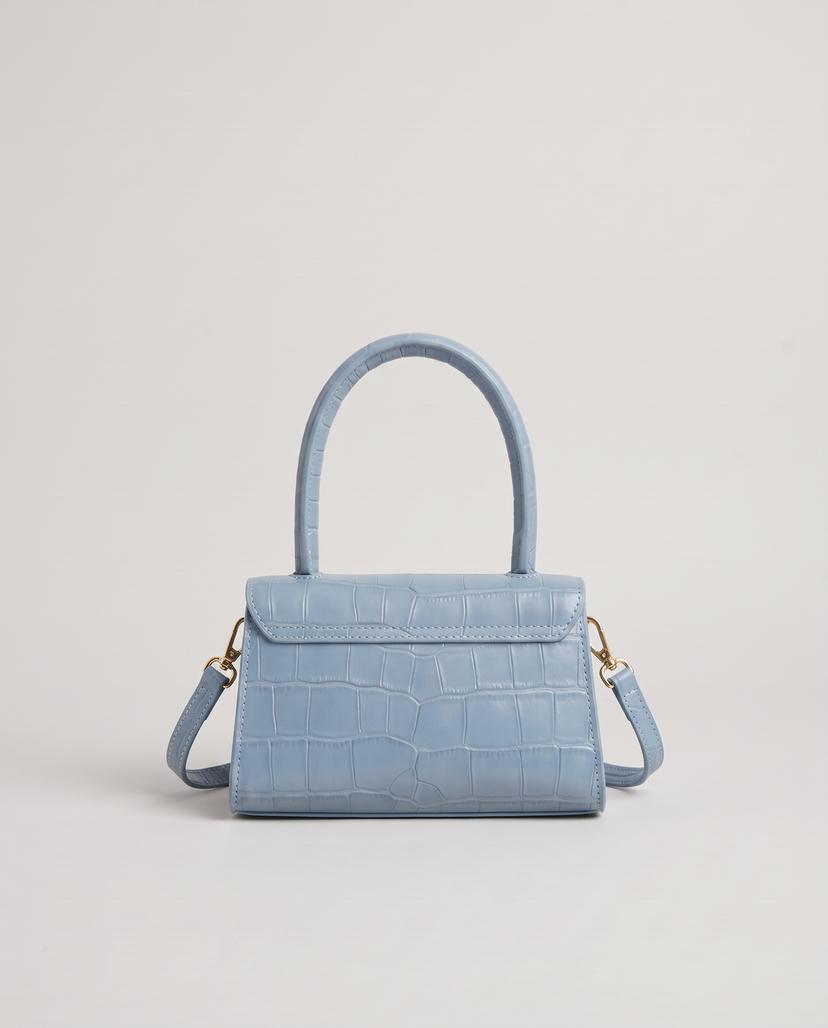 Fern mini croc top-handle bag in Blue – back view