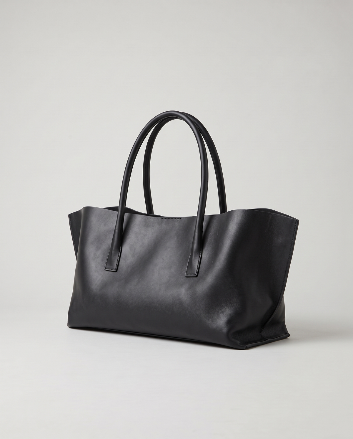 Gaia leather tote in black, three-quarter view