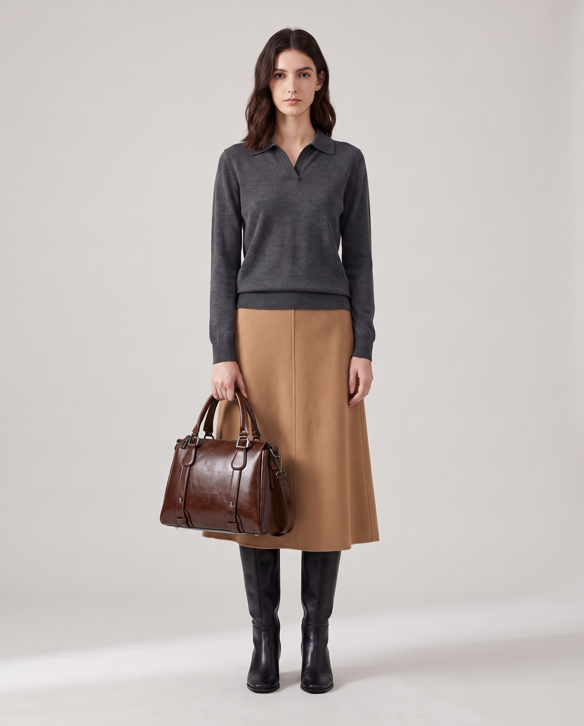 Harlow leather handbag in Coffee – model holding it by the top handles, full length