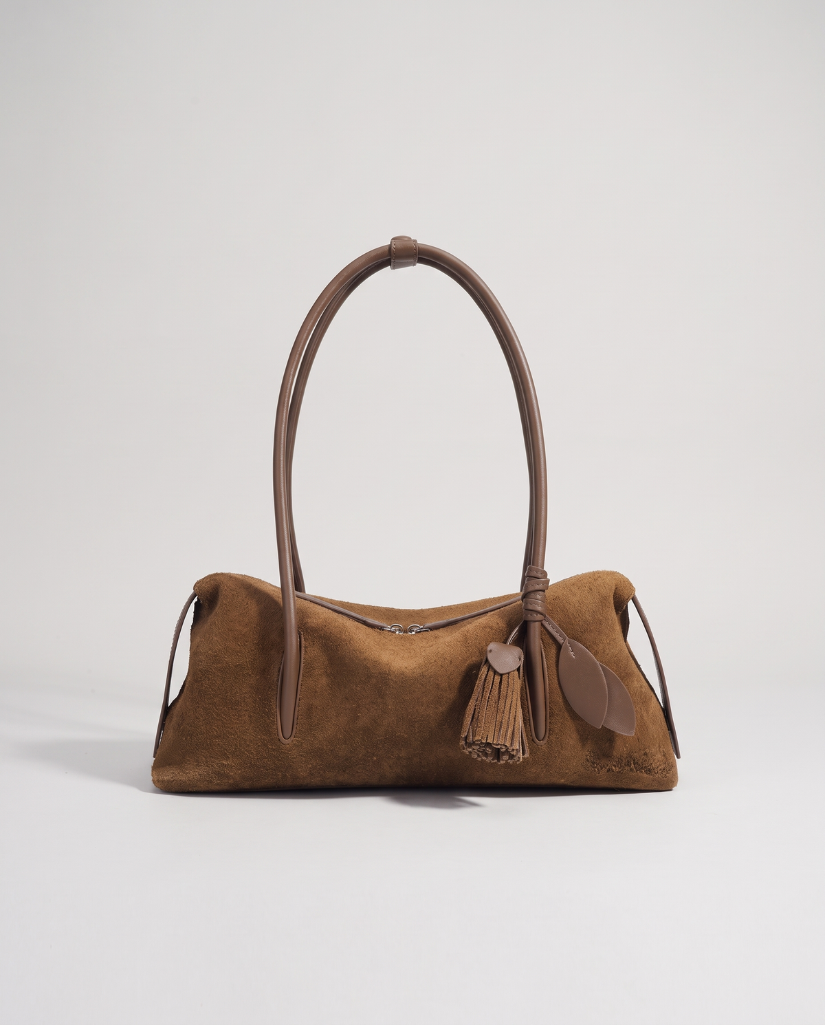 Isola suede shoulder bag in brown, front view