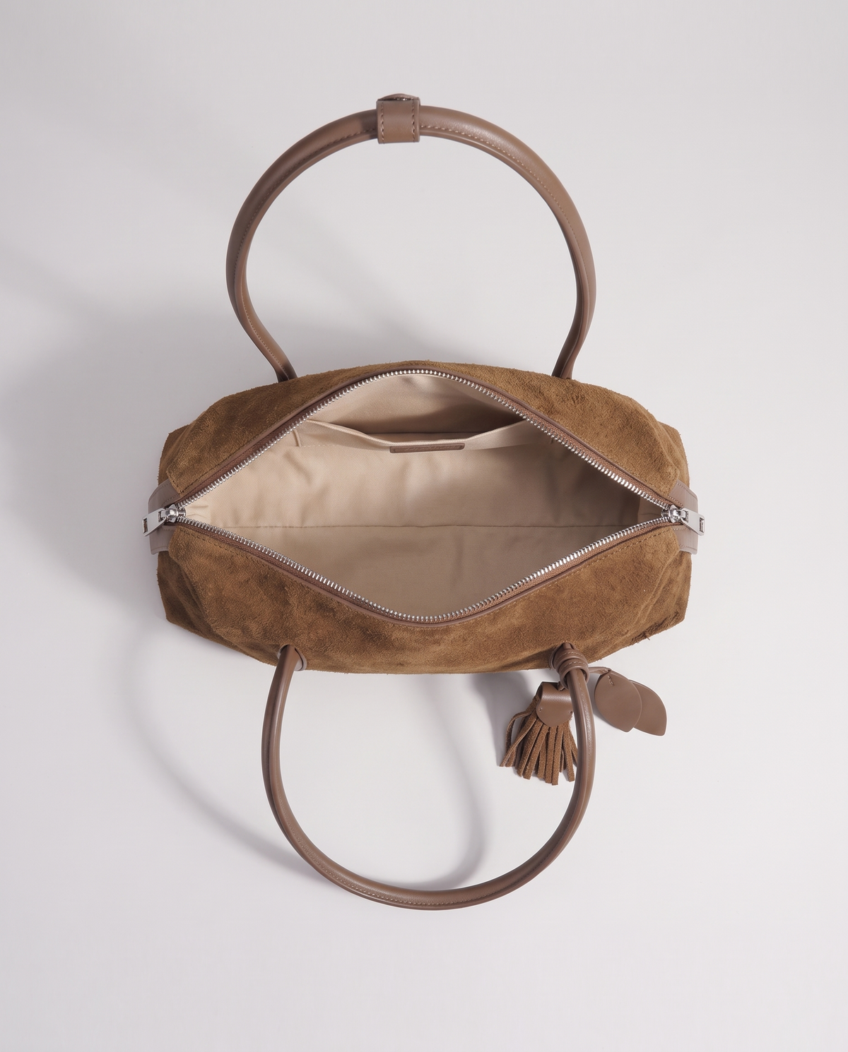 Isola suede shoulder bag in brown, open showing interior