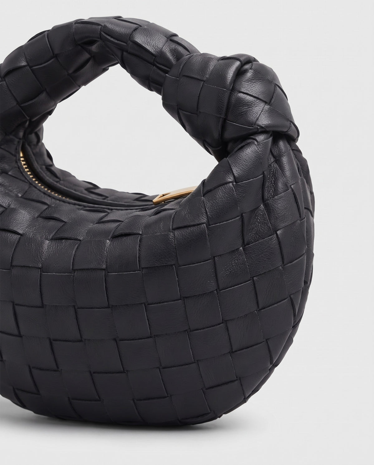 Knot Mini woven leather bag in Black – close-up of the woven leather