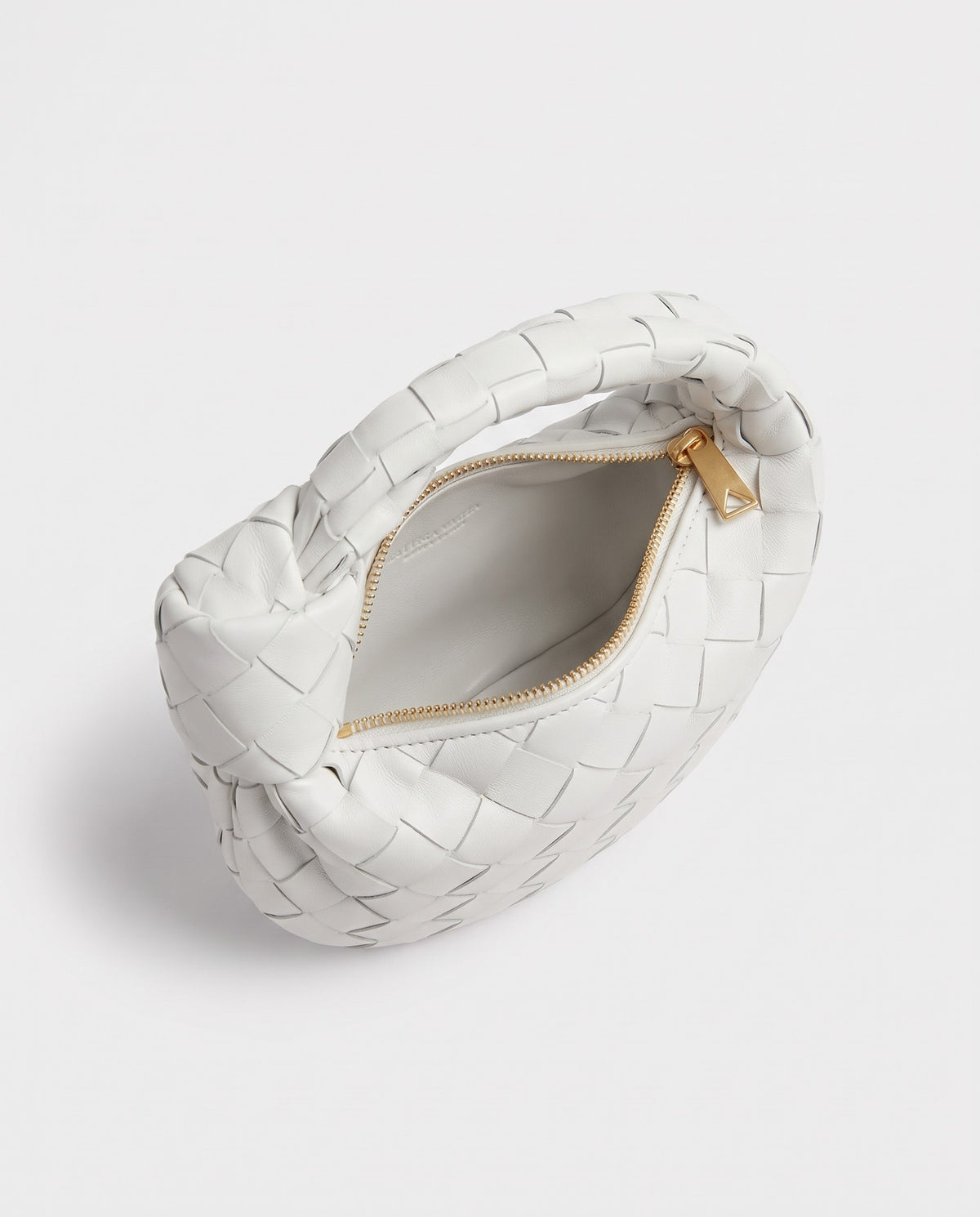 Knot Mini woven leather bag in Chalk – inside view with the zip open