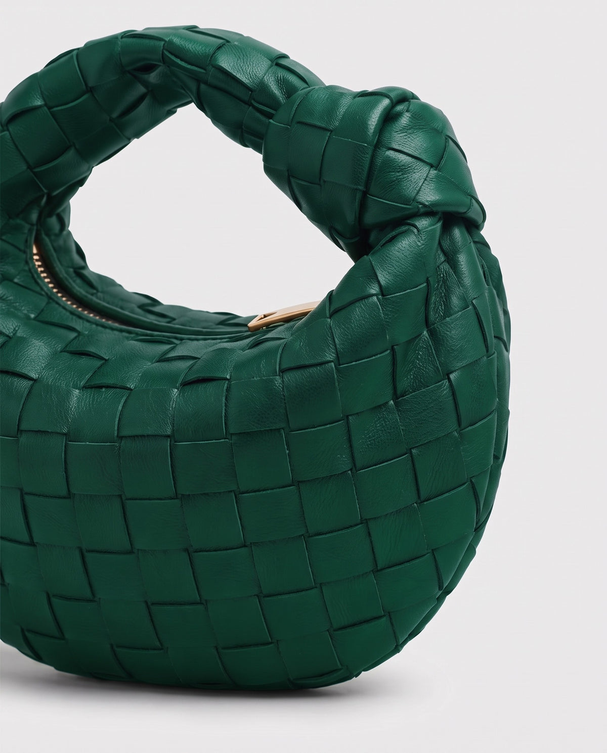 Knot Mini woven leather bag in Emerald – close-up of the woven leather