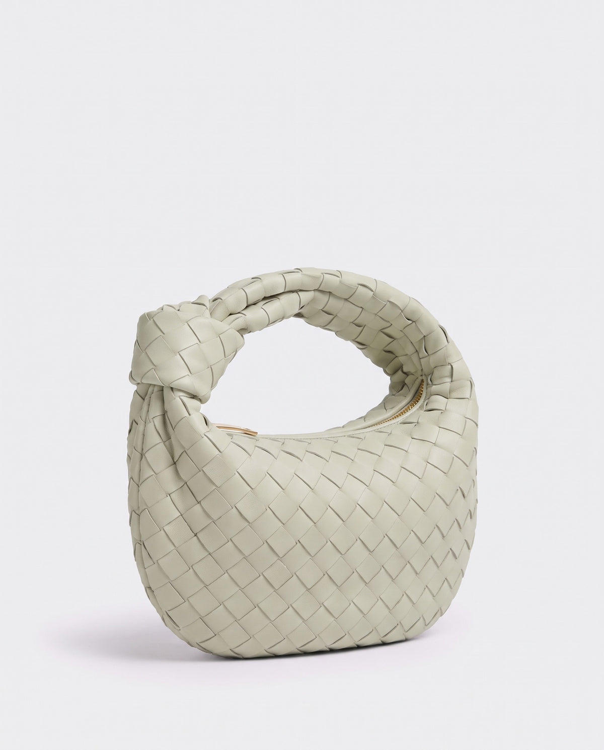 Knot Mini woven leather bag in Pistachio – three-quarter view