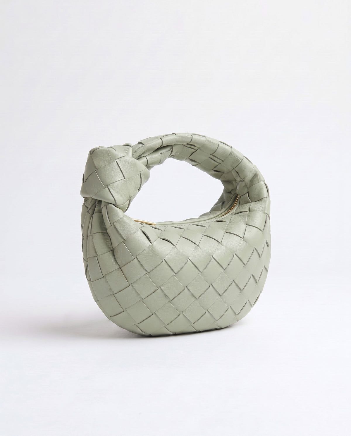 Knot Mini woven leather bag in Pistachio – three-quarter view