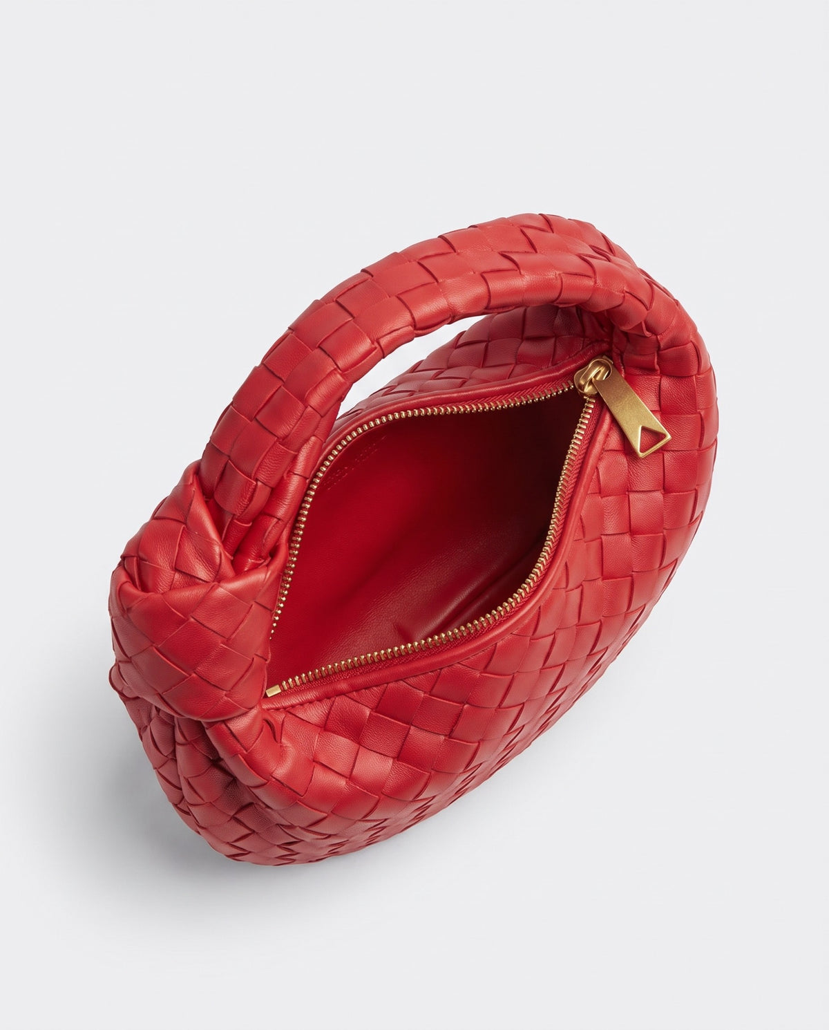 Knot Mini woven leather bag in Scarlet – inside view with the zip open