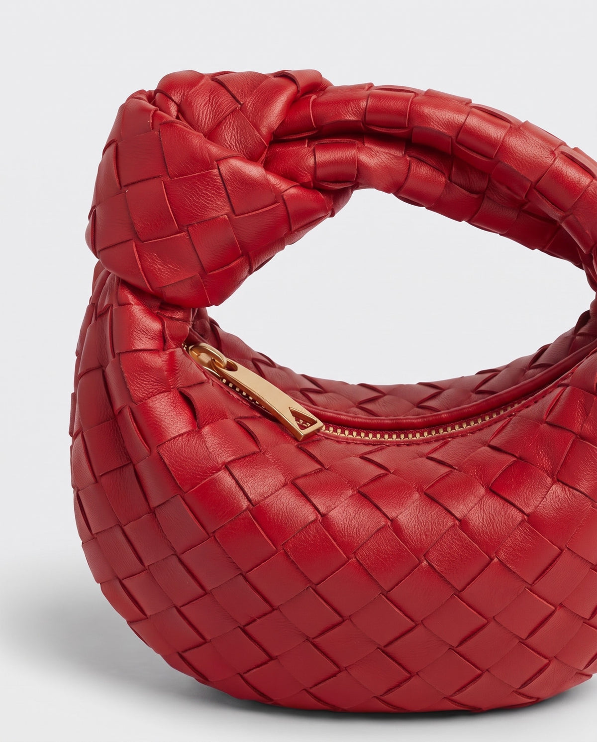 Knot Mini woven leather bag in Scarlet – close-up of the knotted handle