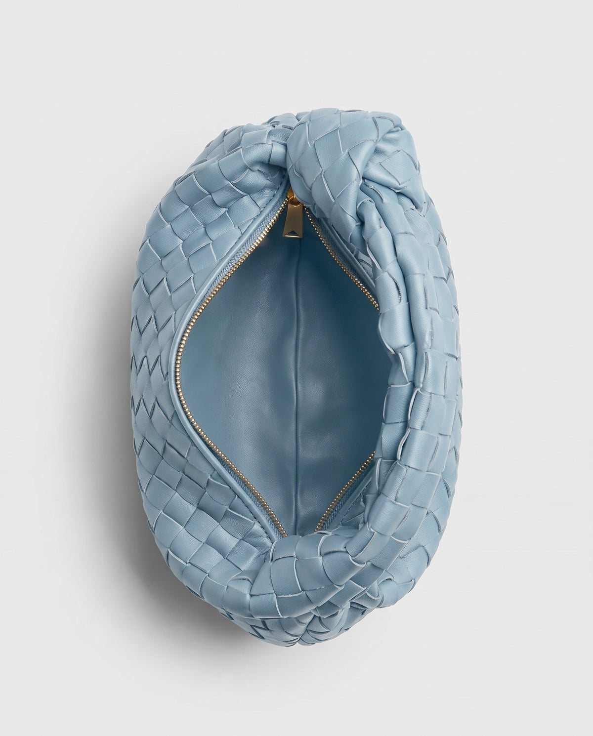 Knot Small woven leather bag in Sky Blue – inside view with the zip open