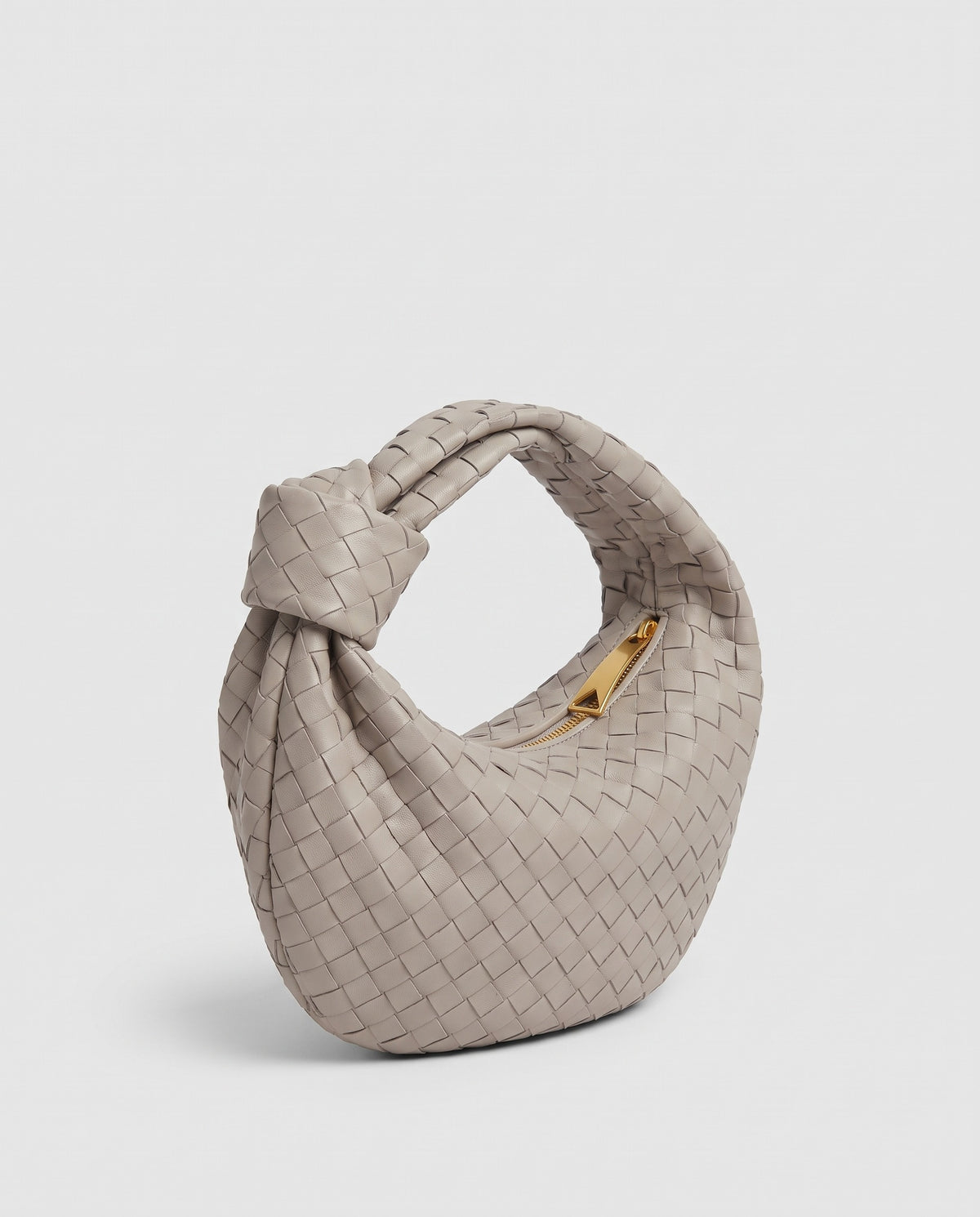 Knot Small woven leather bag in Stone – three-quarter view