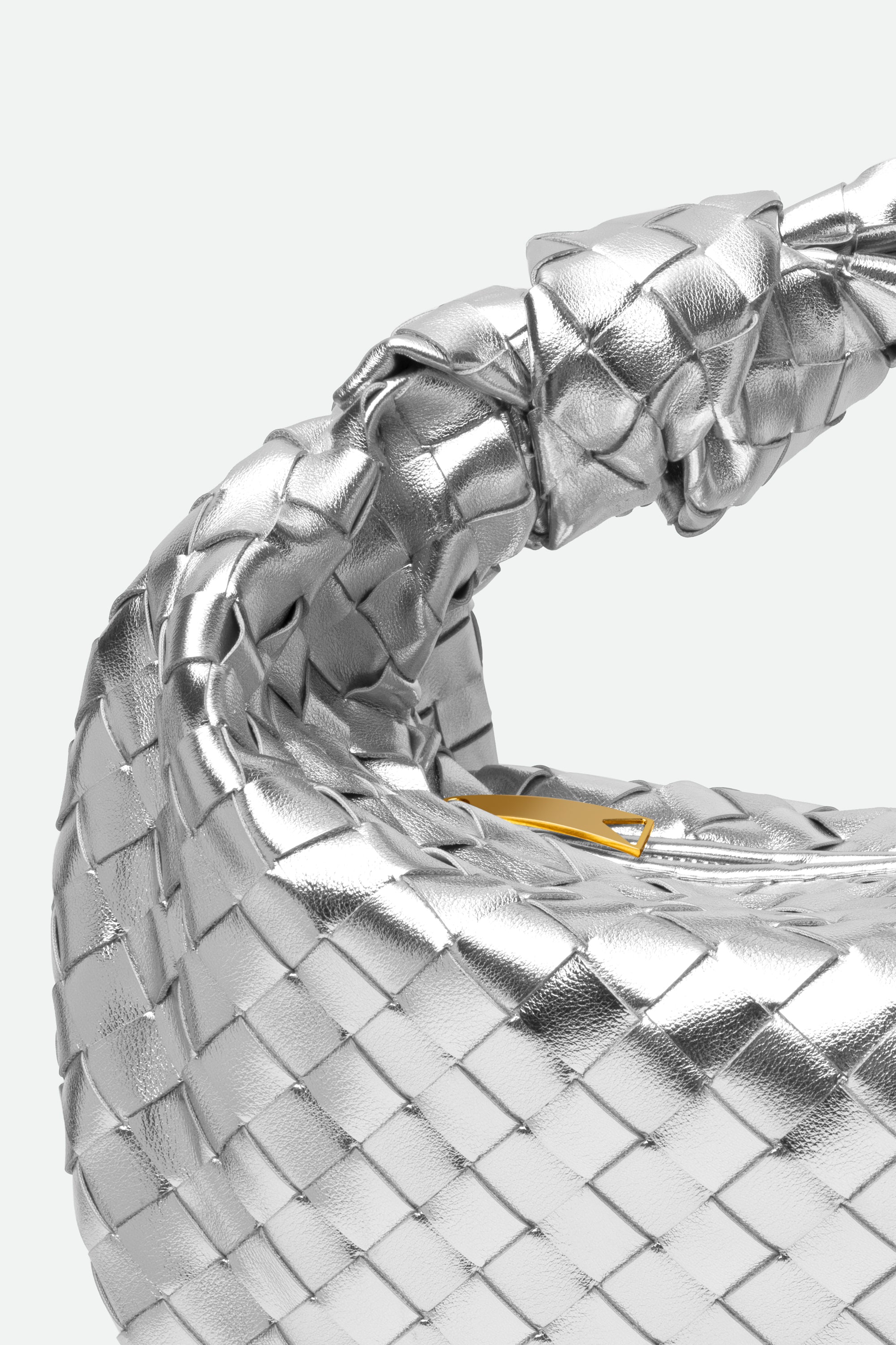 Close-up of Large Knot Bag (Jodie) silver woven handbag with a knotted handle and gold hardware.